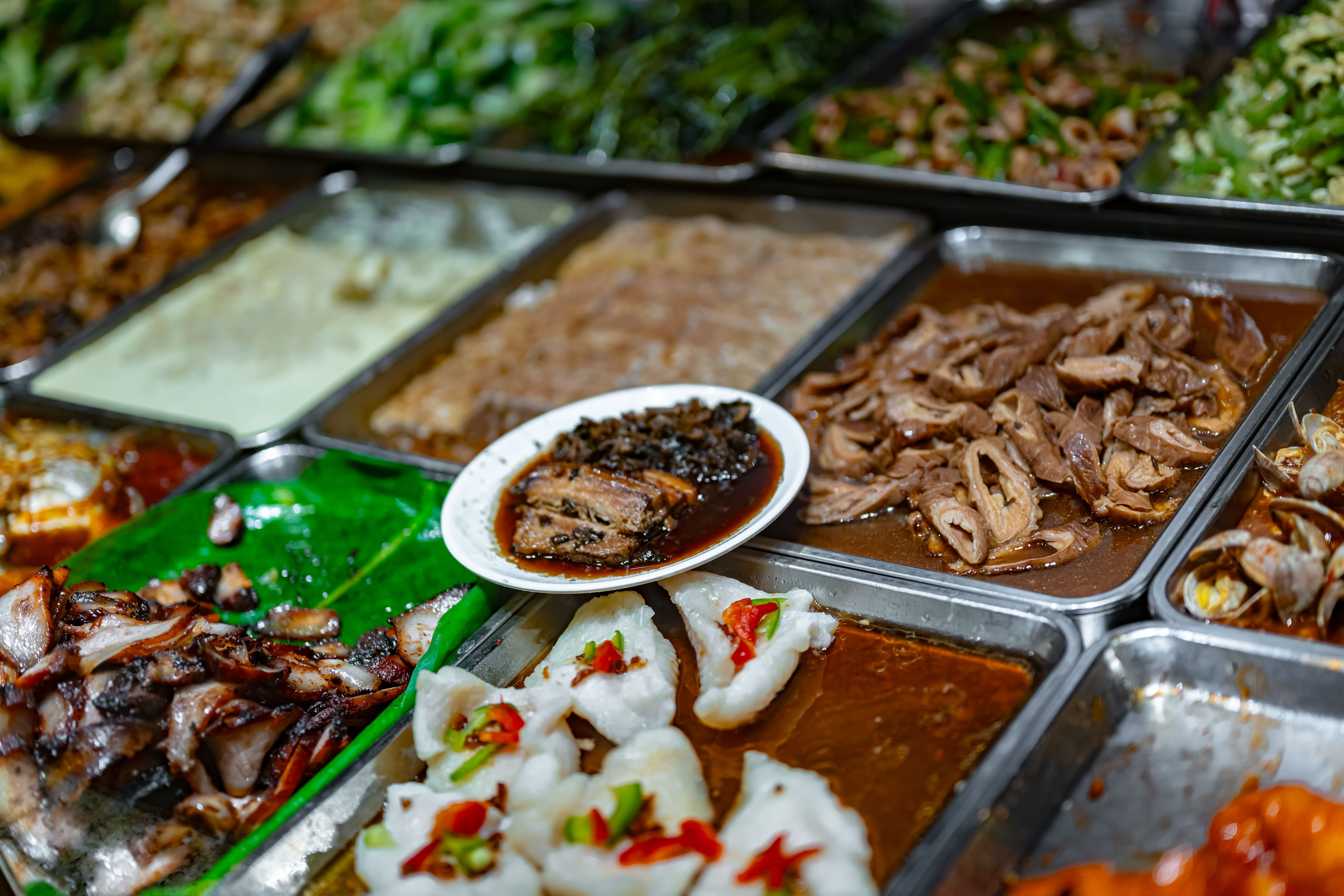 Traditional Asian dishes sold in a food court in Singapore