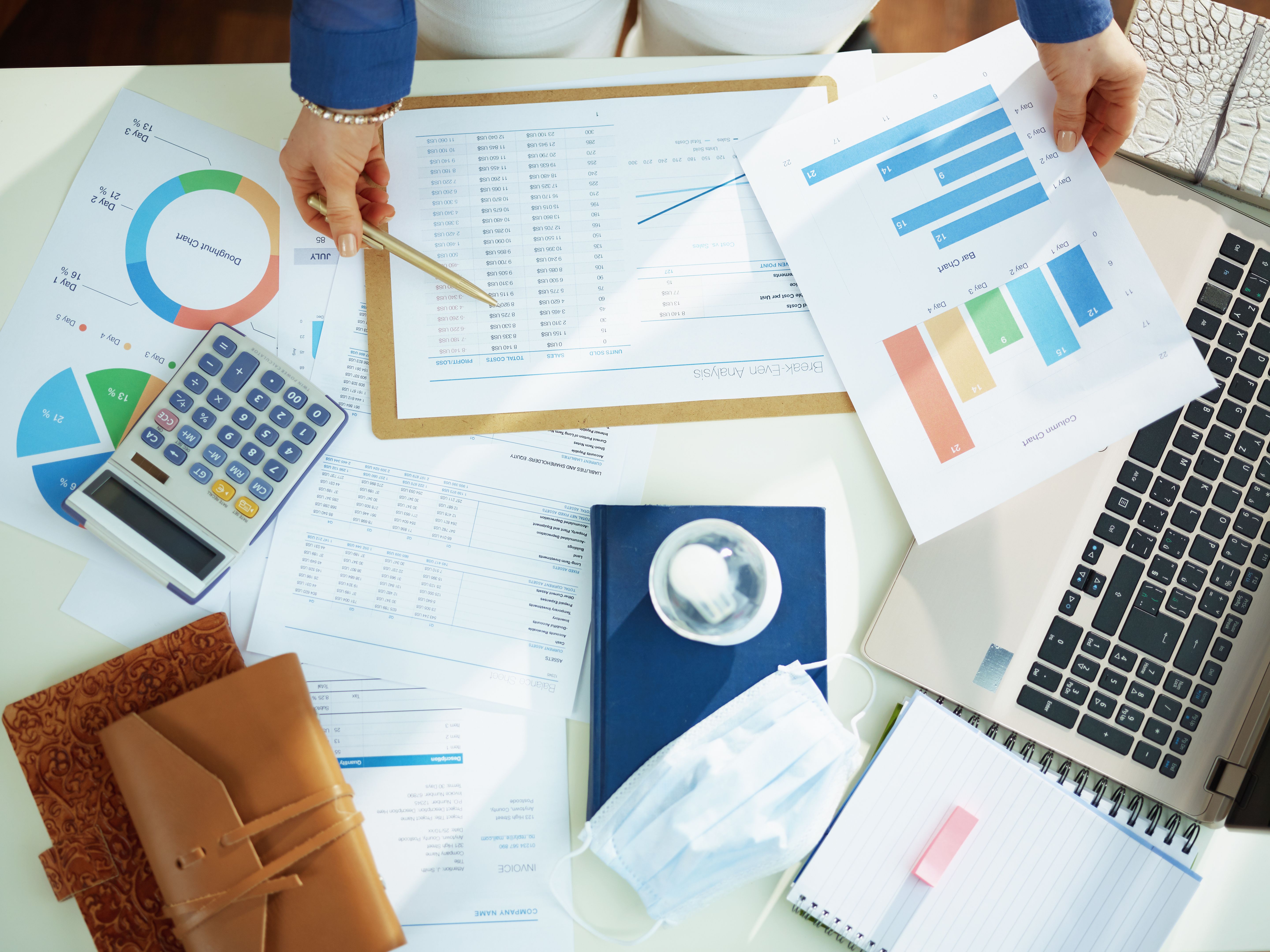 Upper view of business woman working with documents at table