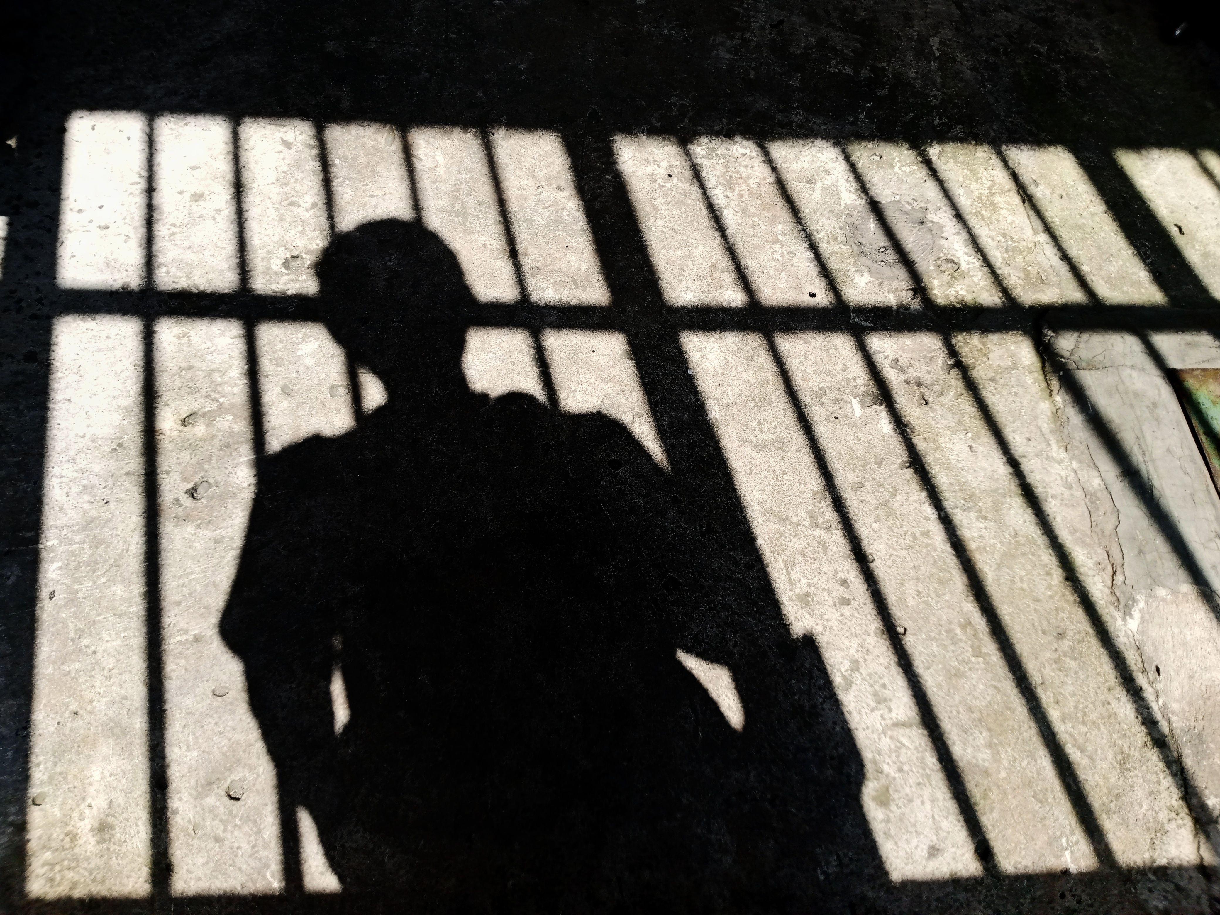 Silhouette of a person at the gate