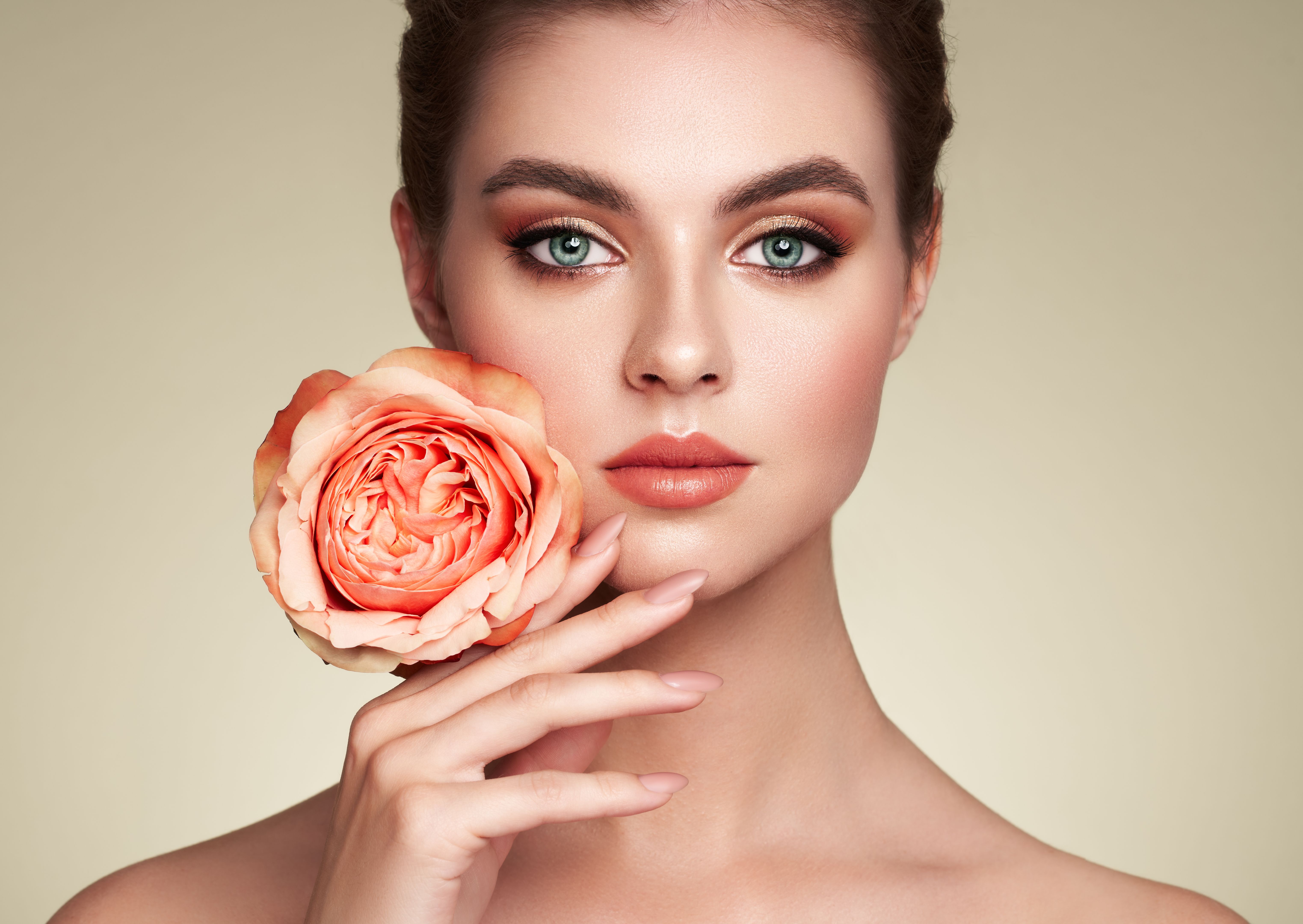 Beautiful young woman a rose flower