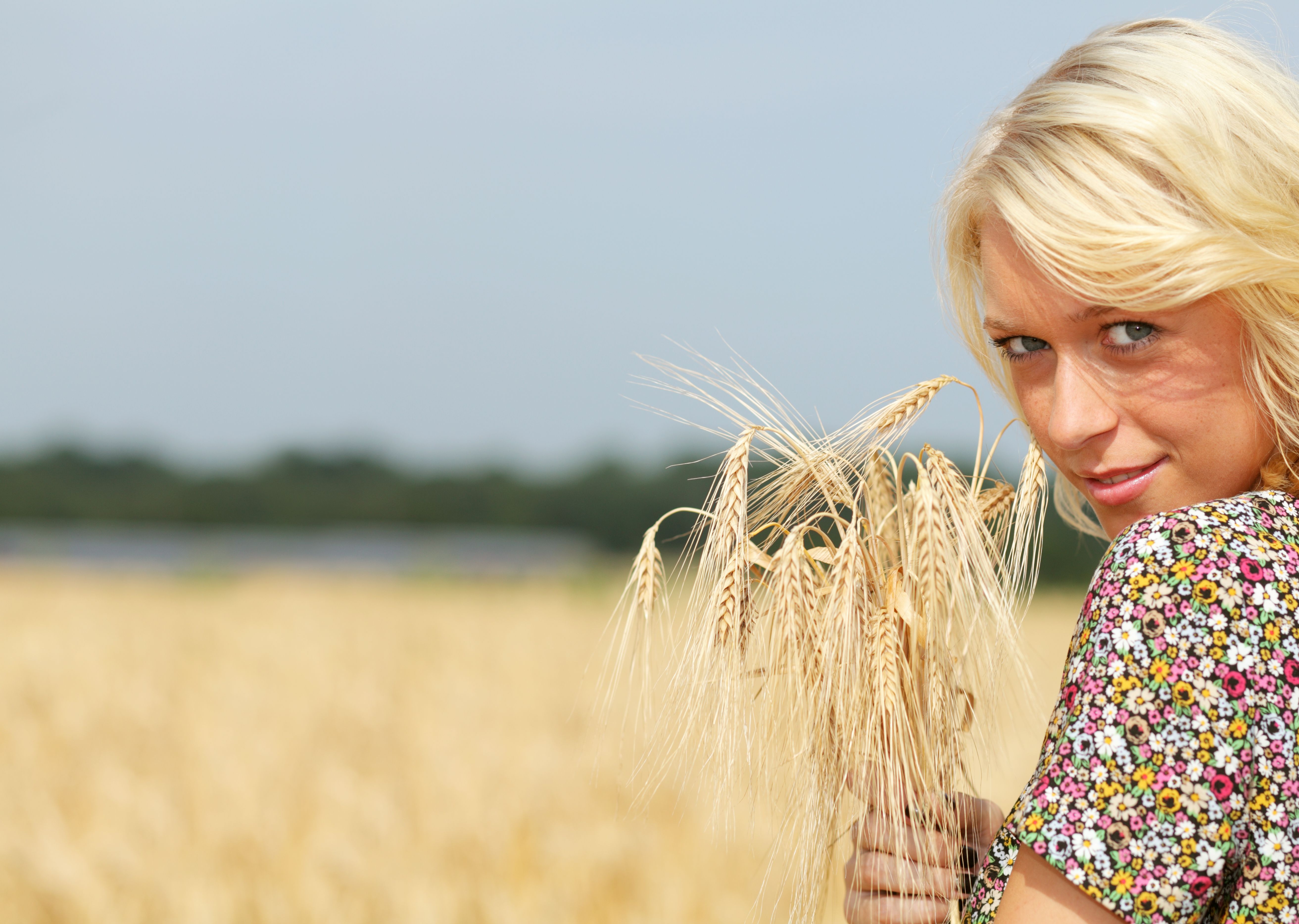 blond female holding grain with copyspace