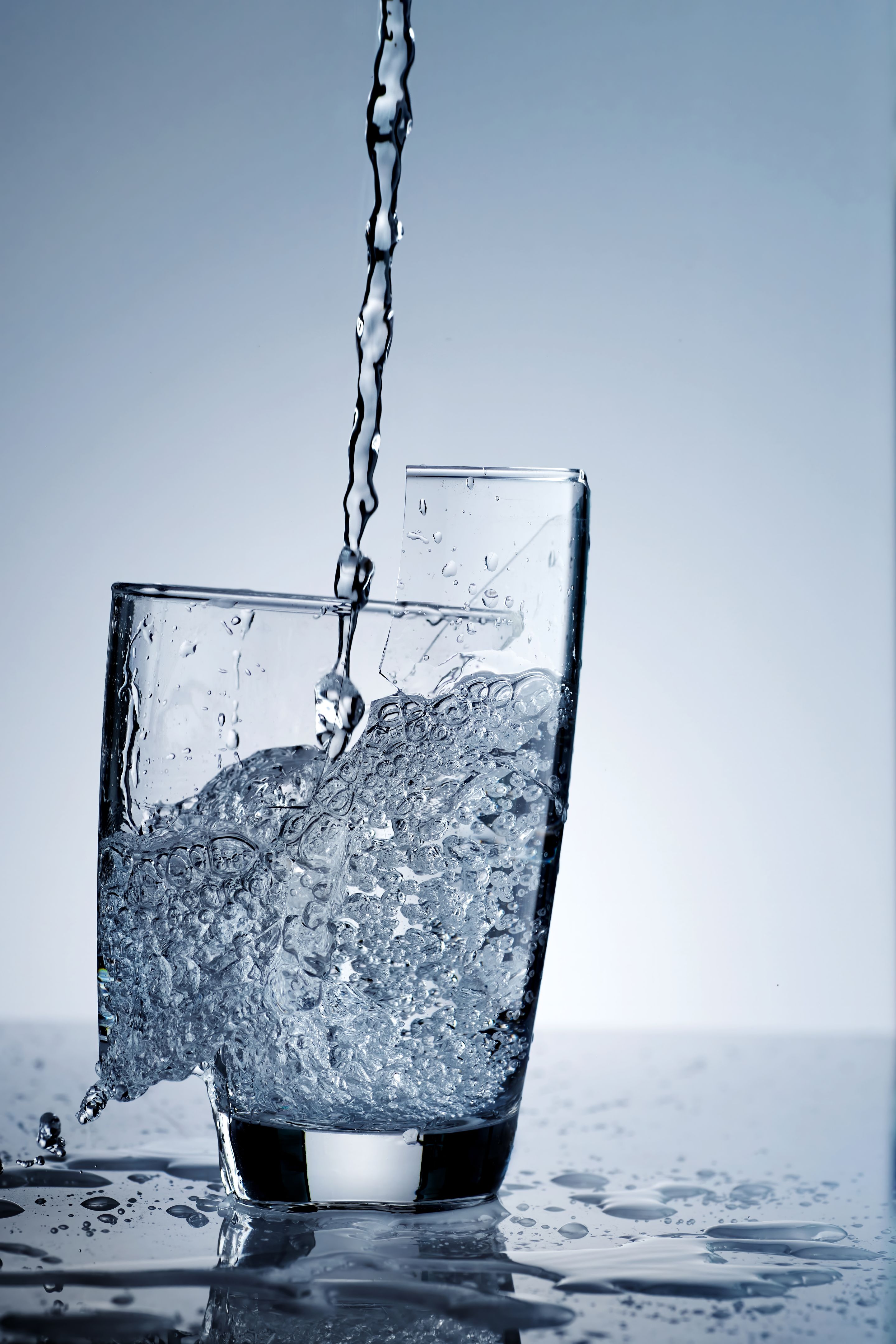 pouring fresh drinking water in hard way that made a glass broken and some part falling down pouring fresh drinking water in hard way that made a glass broken and some part falling down