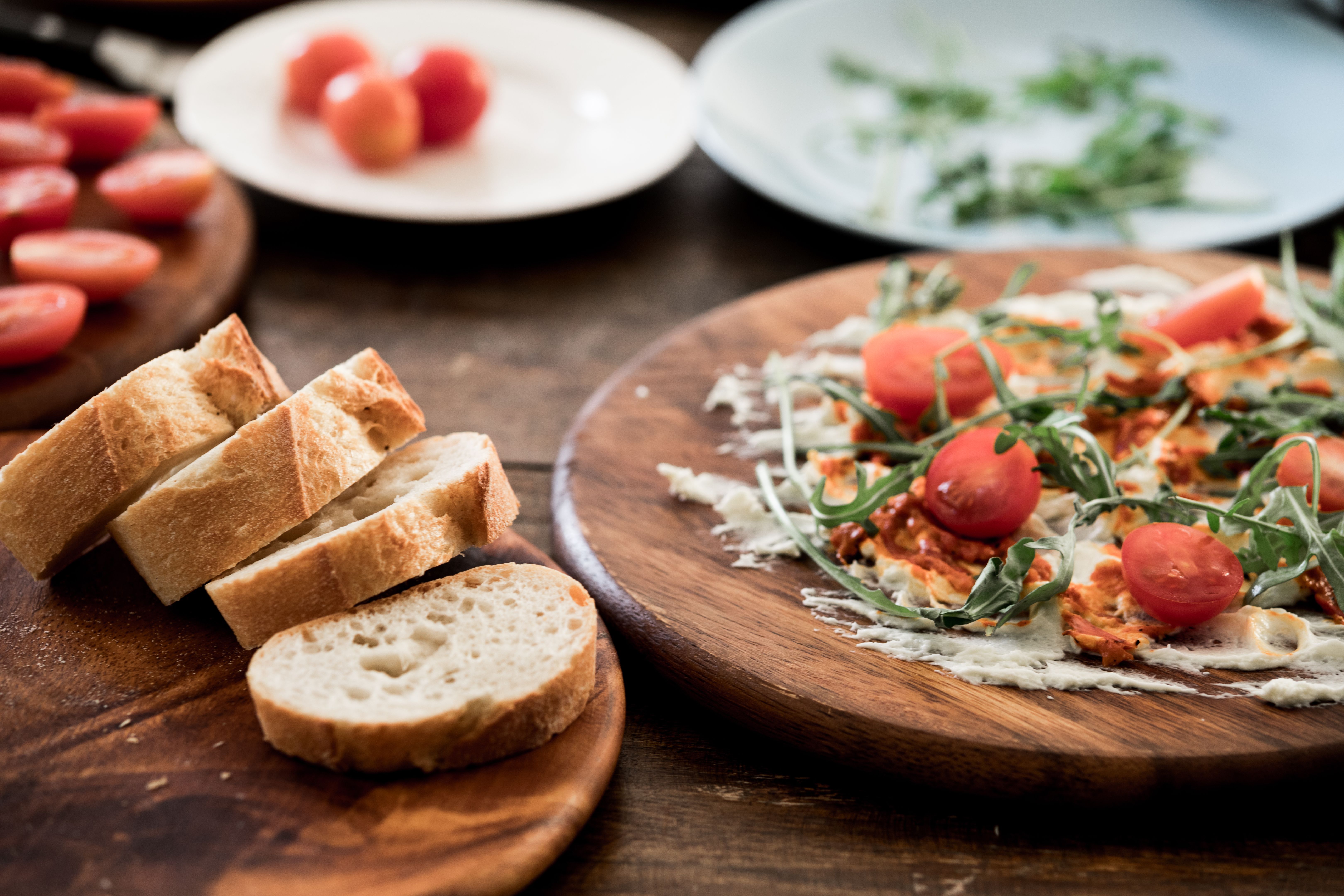 Butter board simple snack dish with baguette slices on table close up
