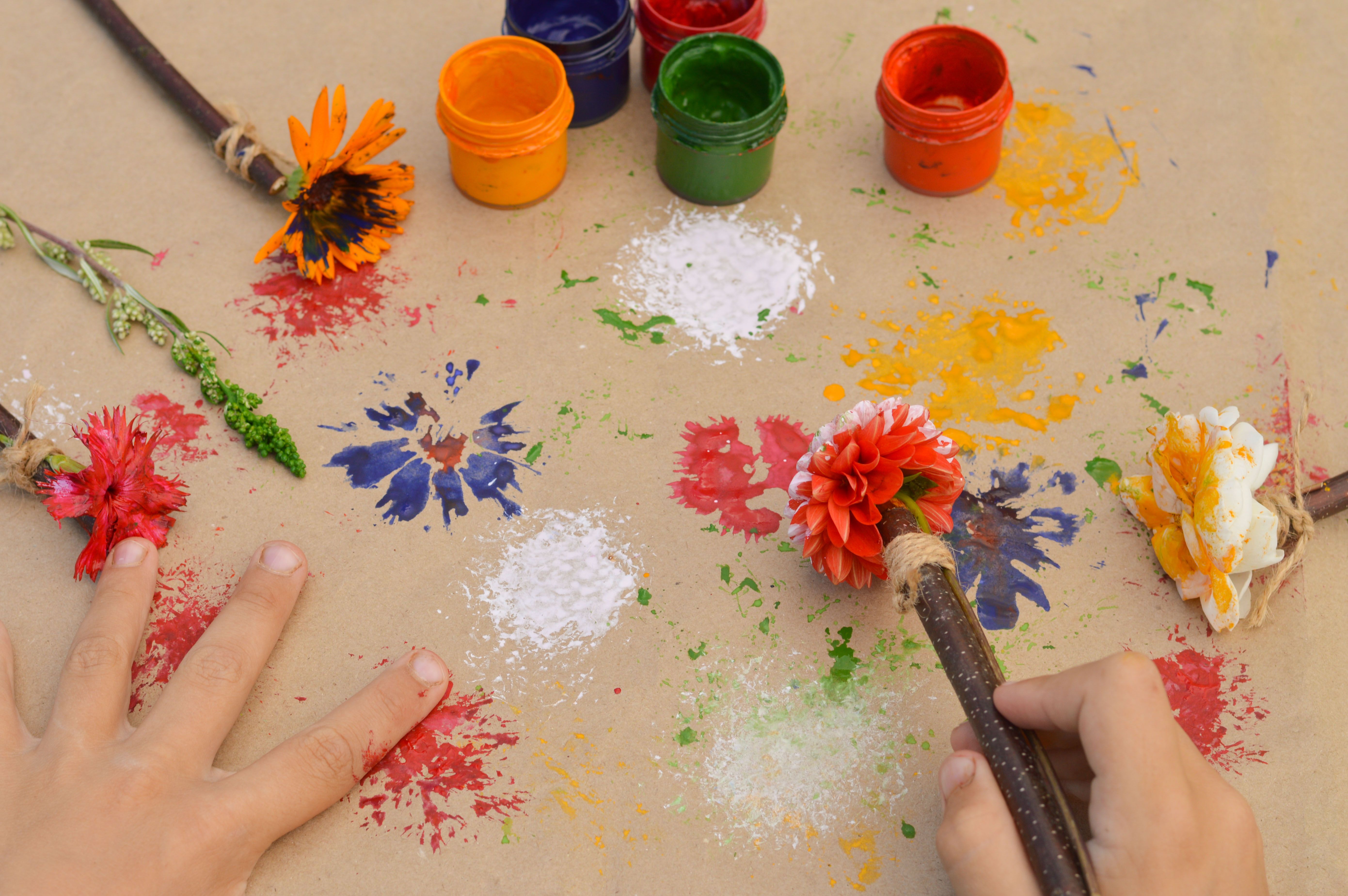 child painting flowers