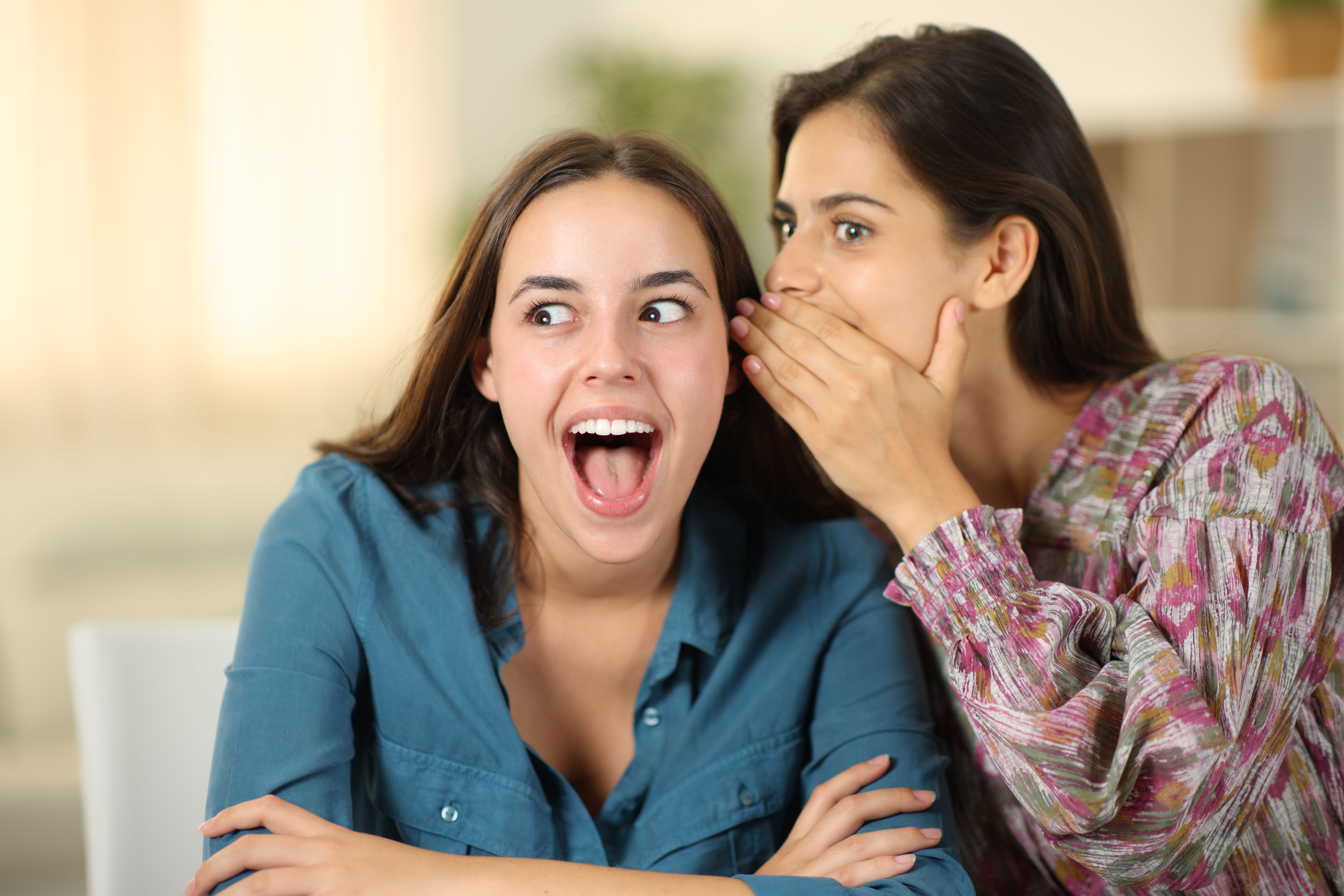 Woman telling amazing secret to a friend Woman telling amazing secret to a friend