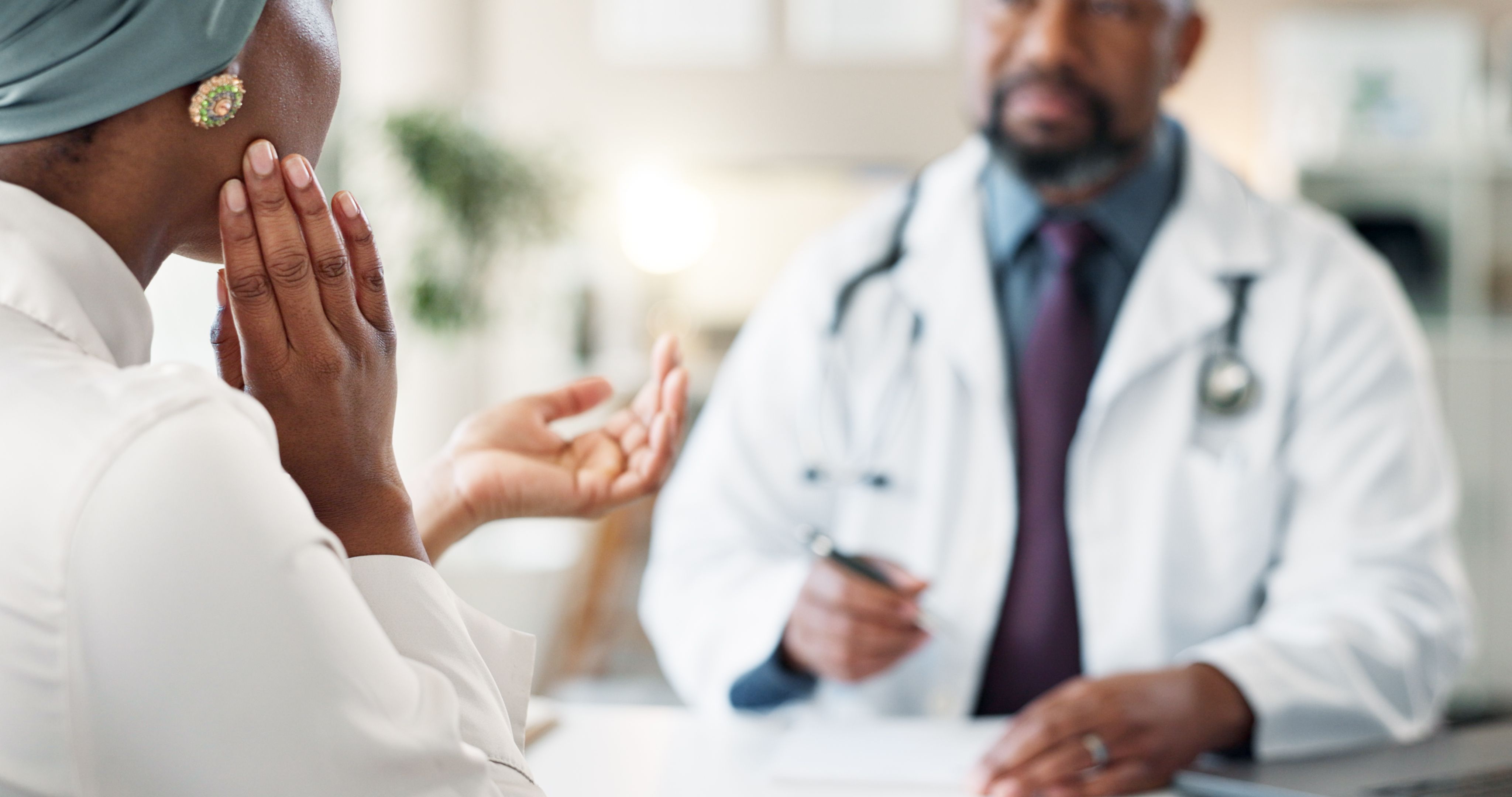 Healthcare, consulting and doctor with patient in clinic for orthopedic expert, jaw pain and tmj treatment. Medical, advice and meeting with people in hospital for insurance, feedback or test results