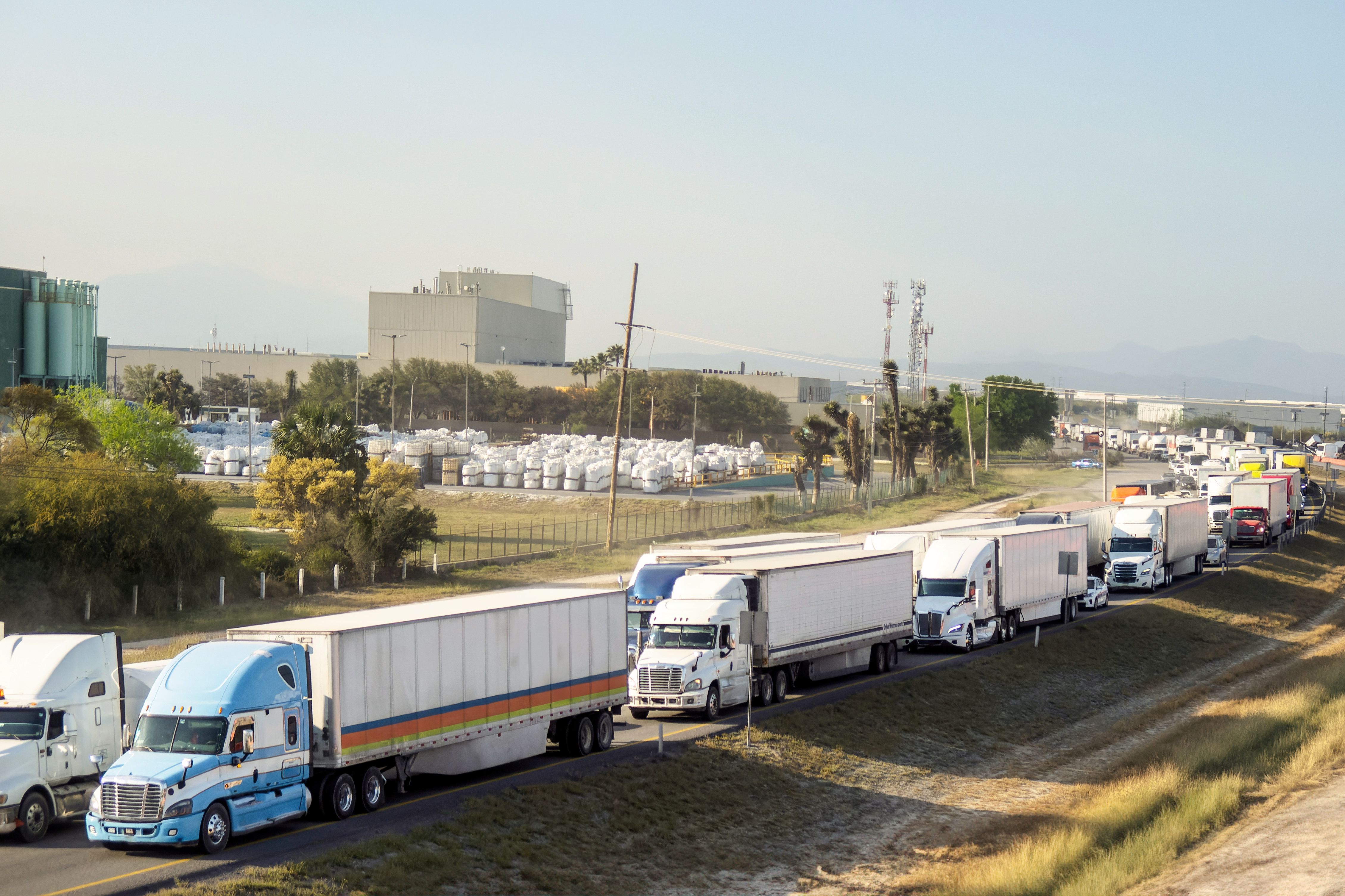 A group of trailers stuck in traffic on a highway