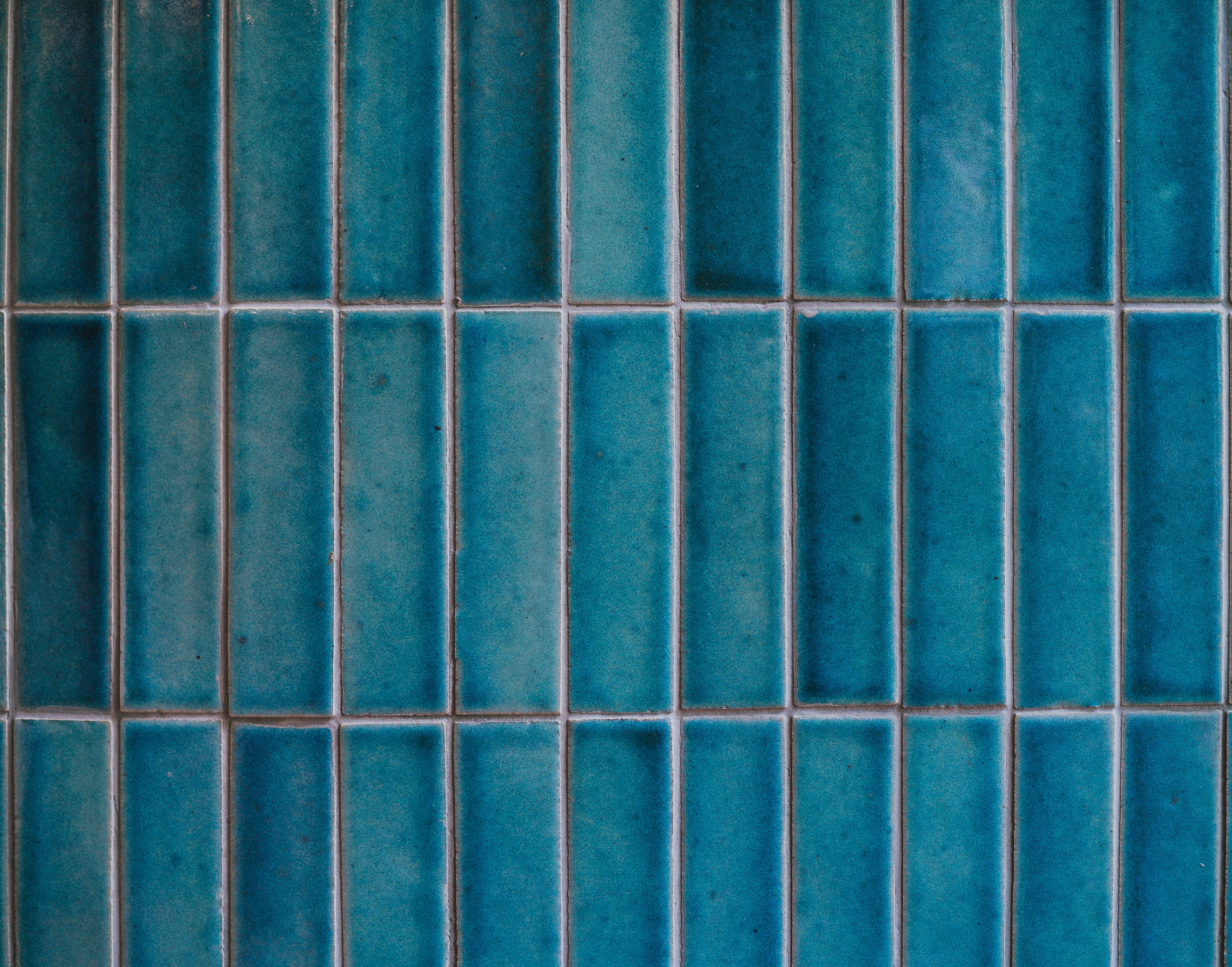 Tiles. A closed up texture of beautiful blue tiles for background pattern. Vintage film grained filter applied.