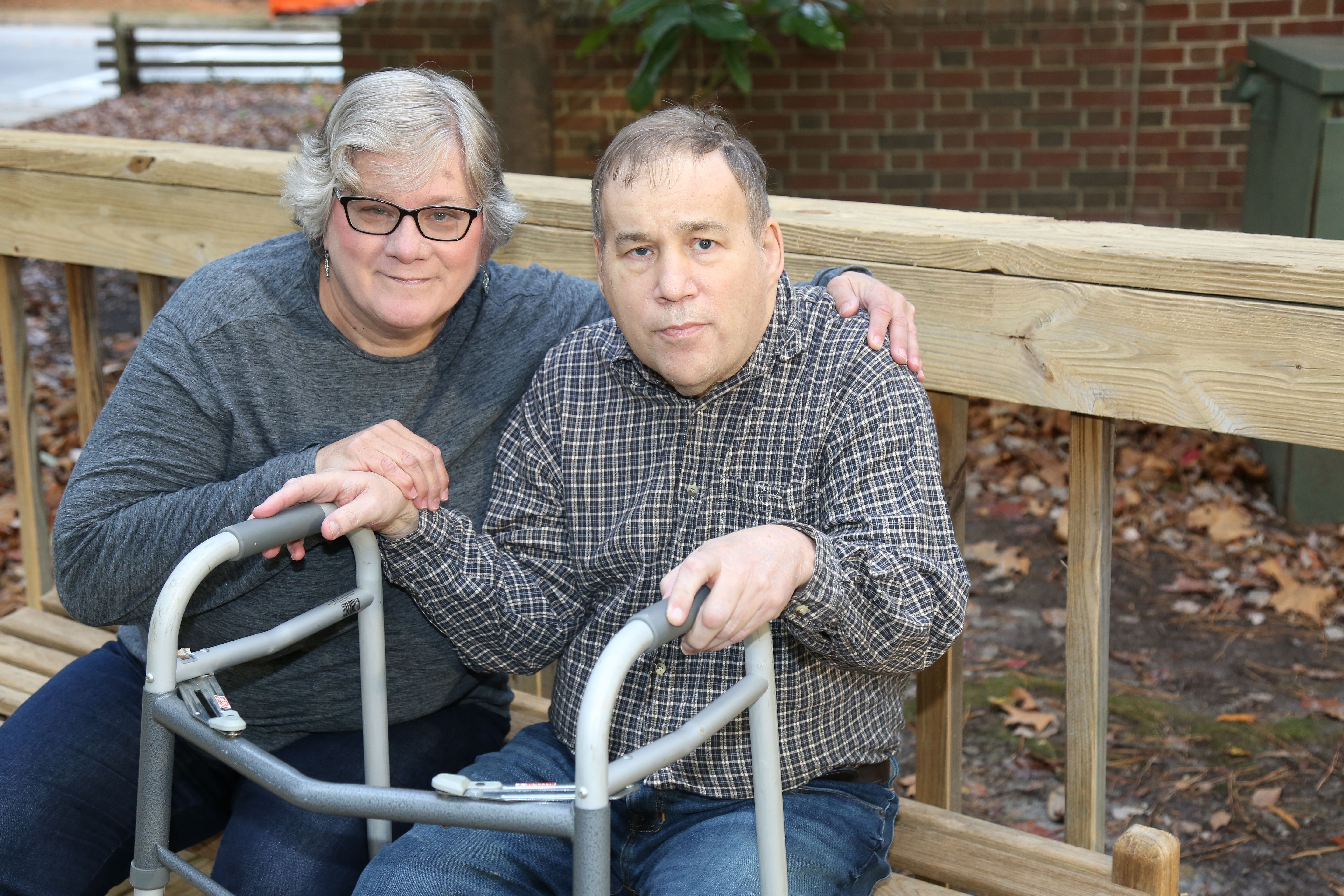 Caretaker and sister taking care of her middle aged  brother who also suffers from autism.