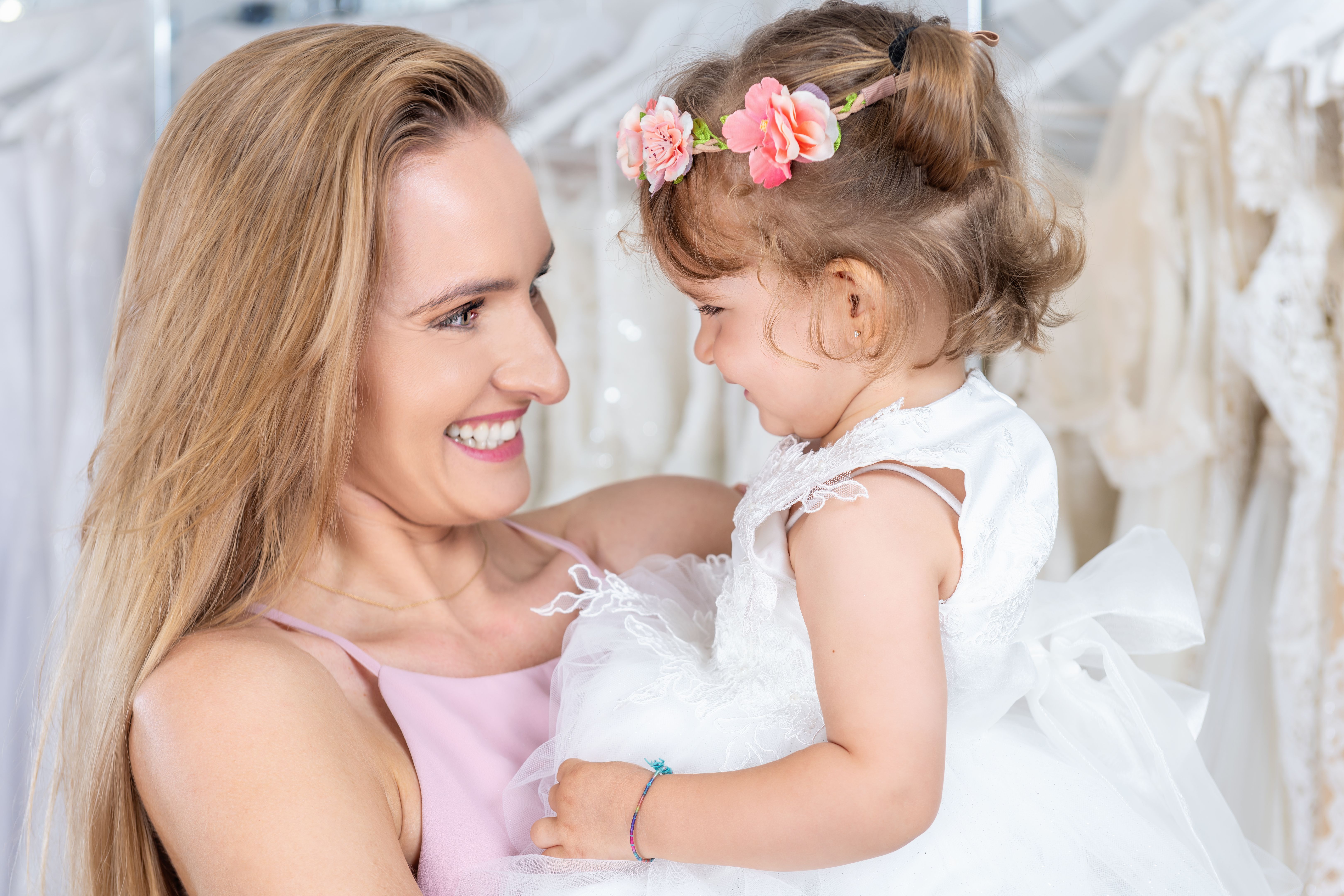 Mother and cute daughter in store