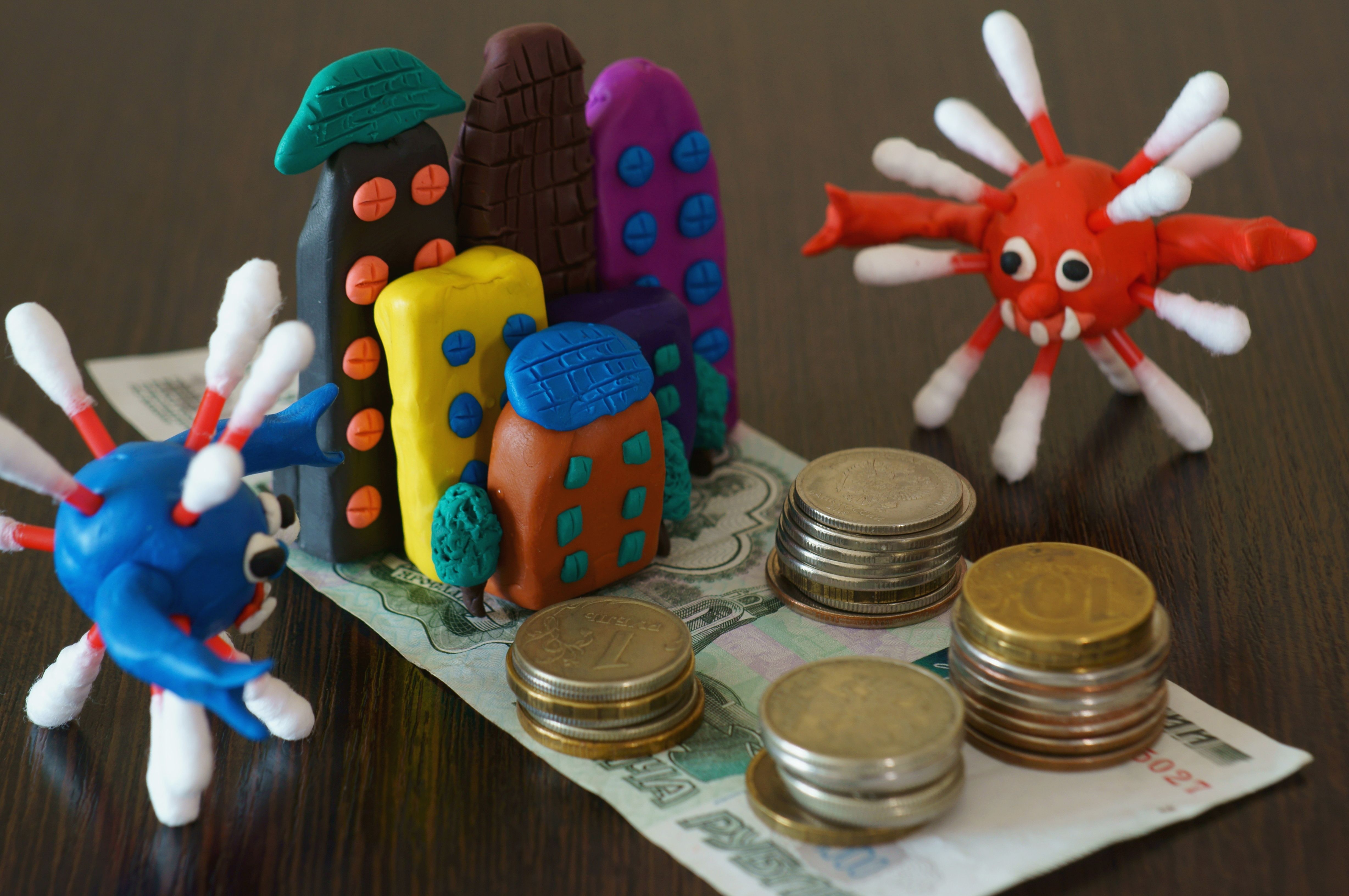 Toy house made of plasticine on the table.