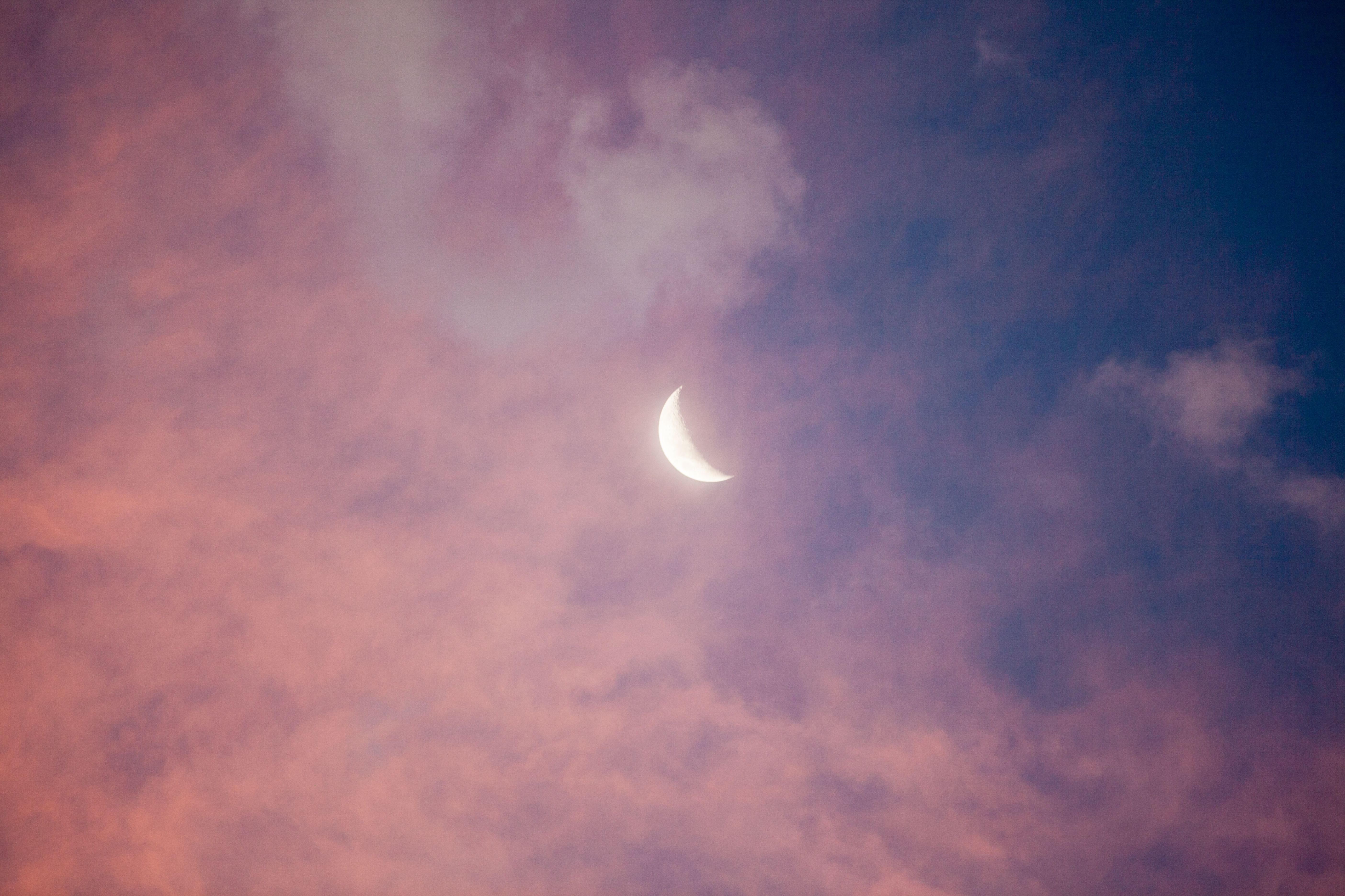 New moon with pink clouds