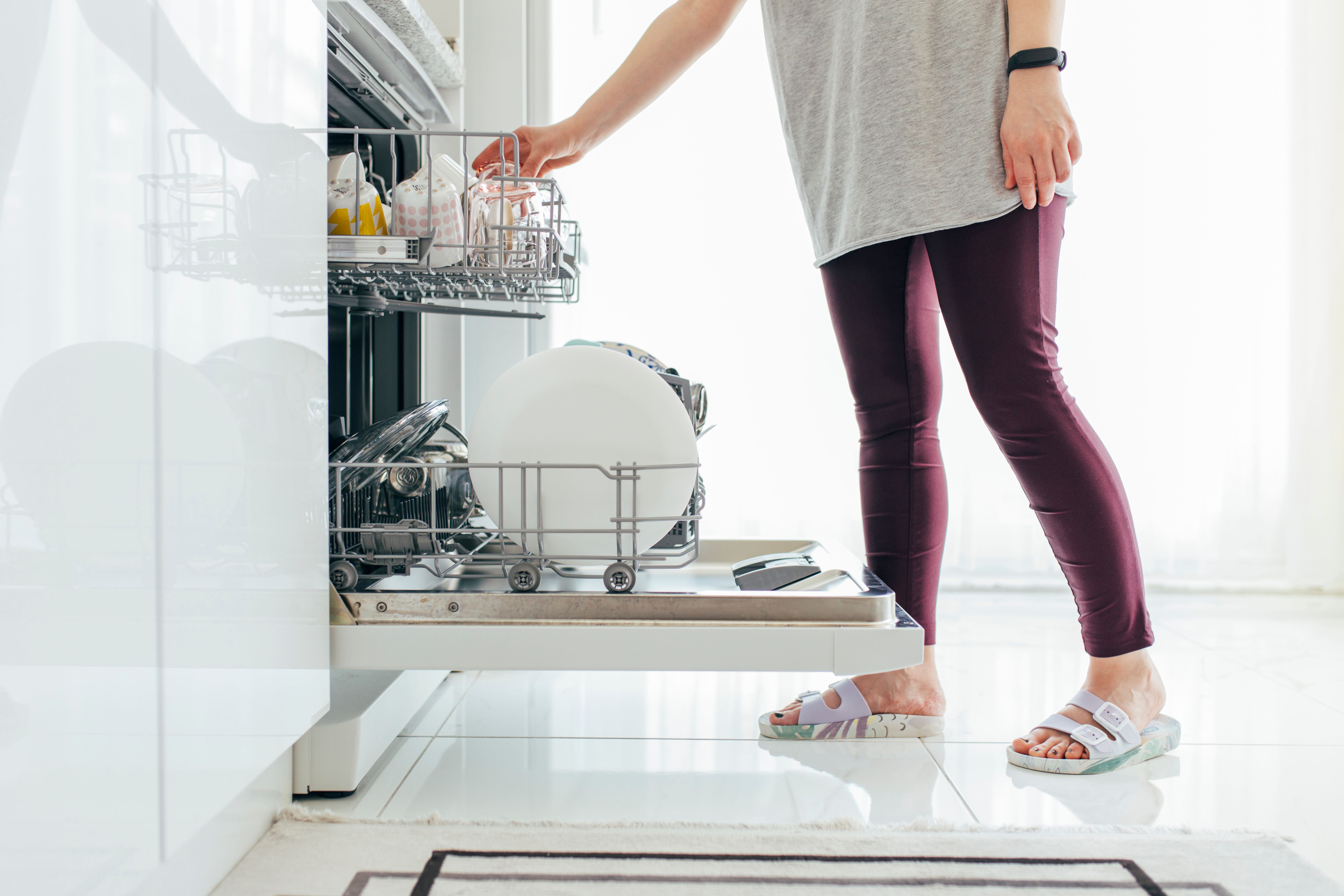 person using dishwasher