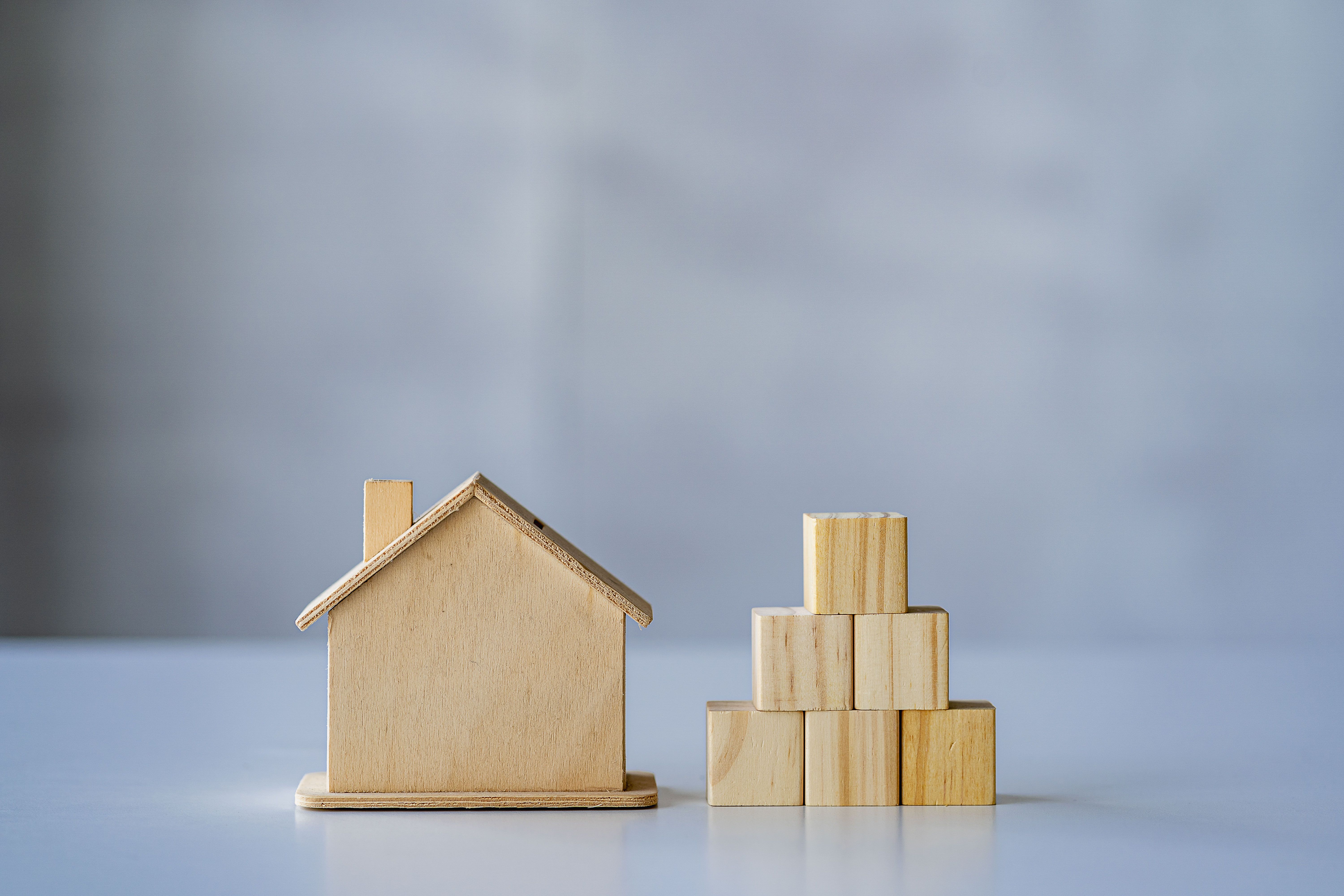 A wooden house with pyramid wooden blocks that can put any message you want.