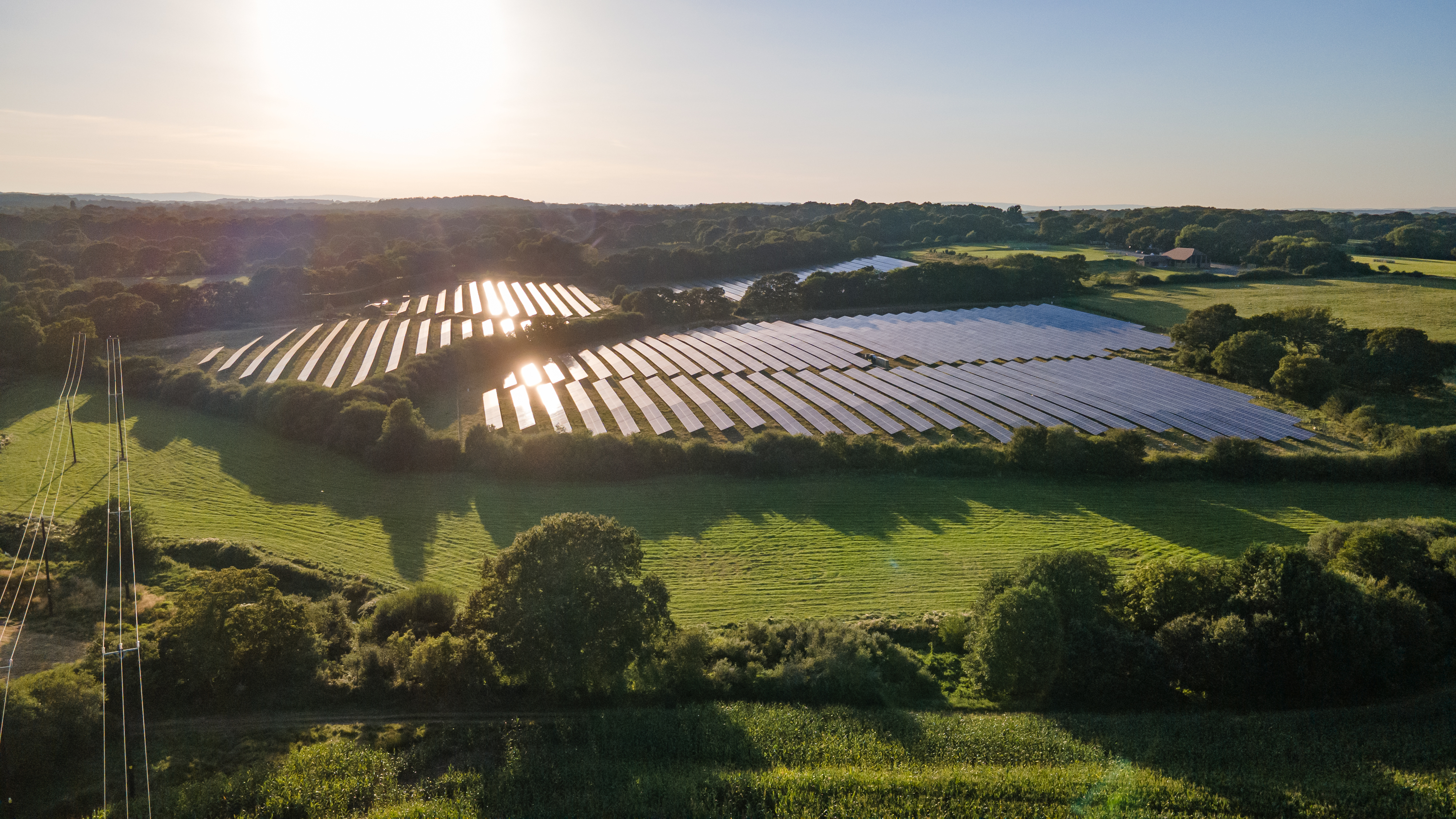 Aerial view of the solar panel in solar farm in evening sun light. Aerial view of the solar panel in solar farm in evening sun light.