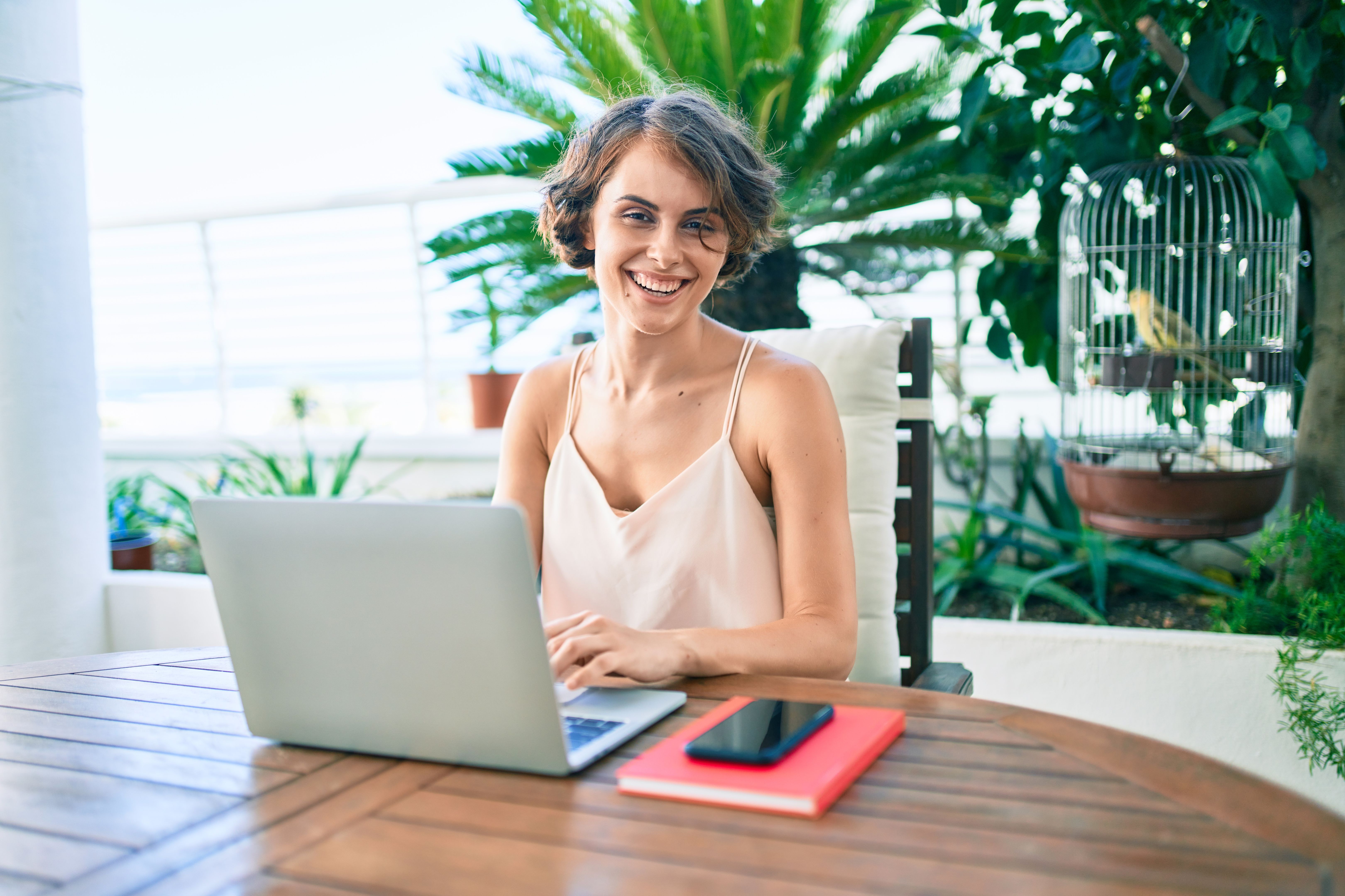 Young beautiful caucasian woman smiling happy working from home