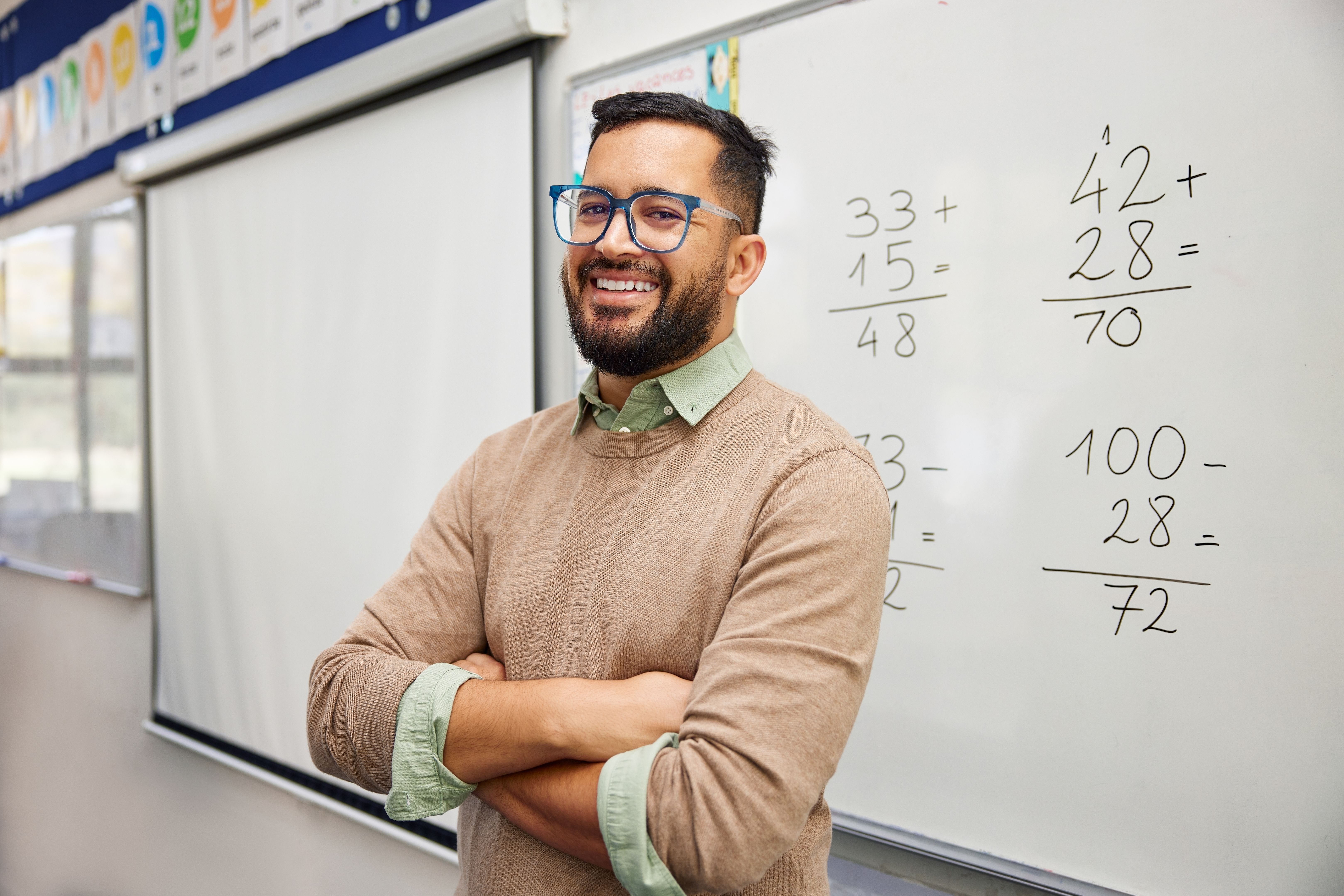 Happy satisfied math teacher in elementary class