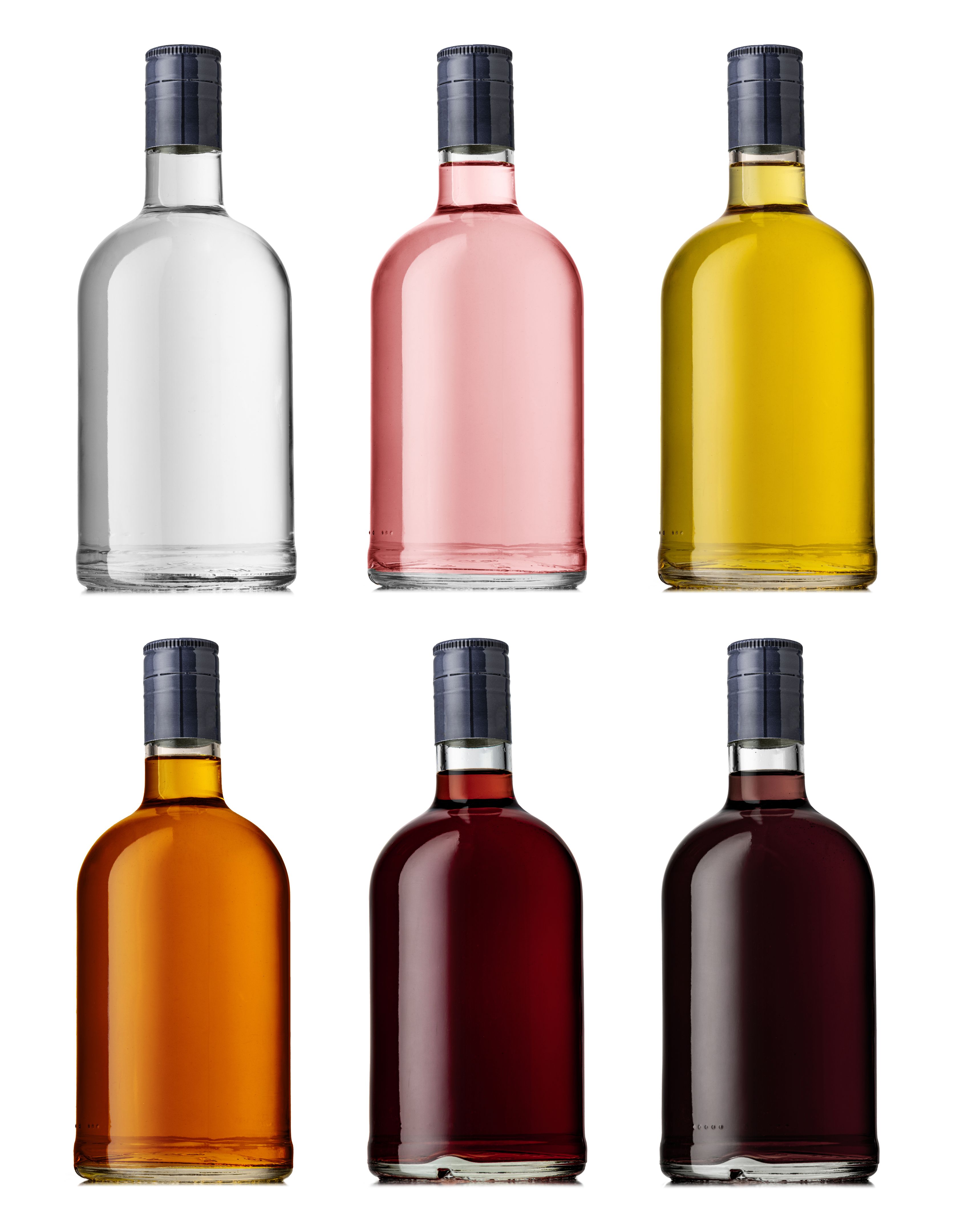 Set of a glass bottle with different color liquids. Isolated on a white background. Alcohol drinks: gin, vodka, brandy, rum, liqueur, whisky.