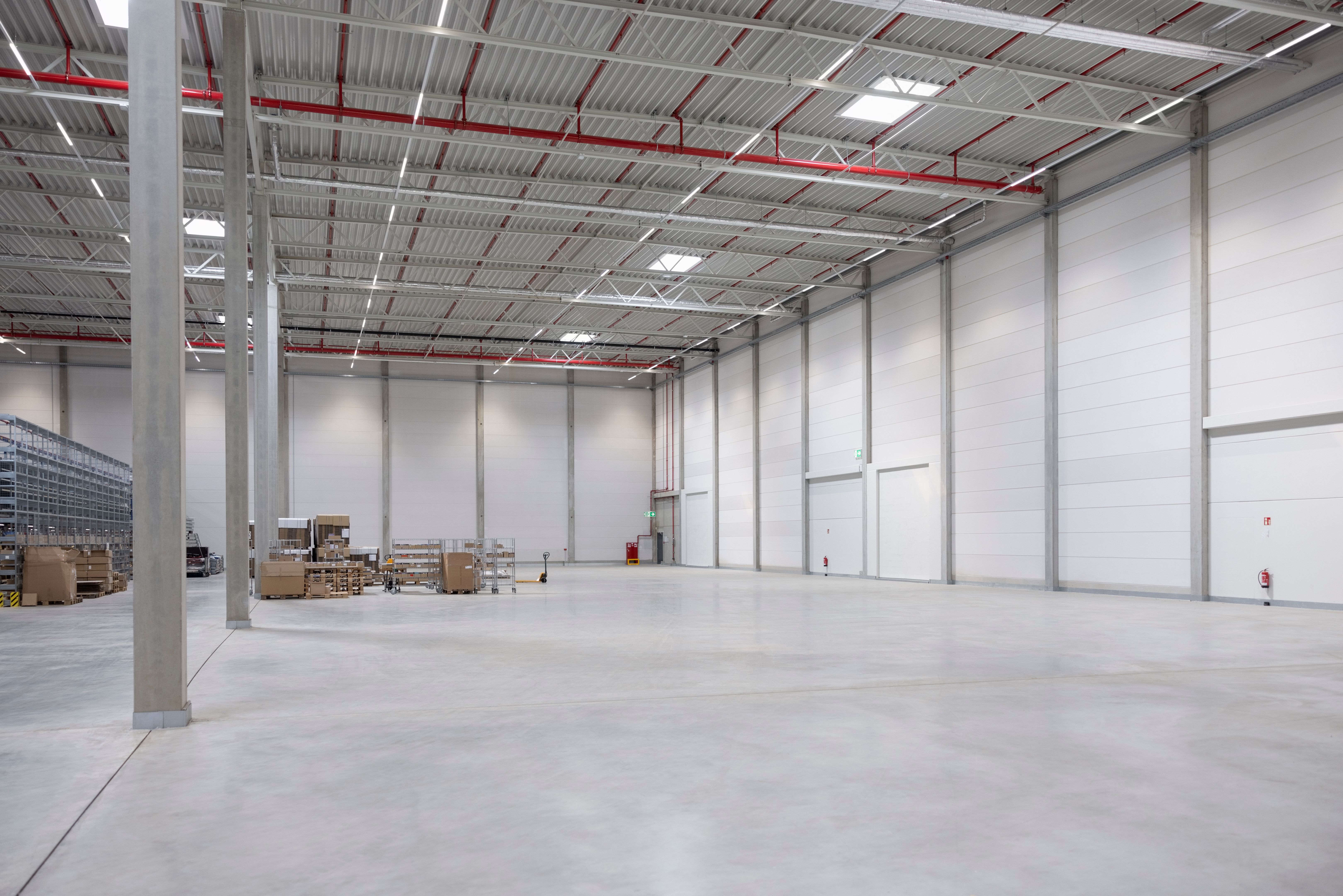 Empty space in large supply chain warehouse interior