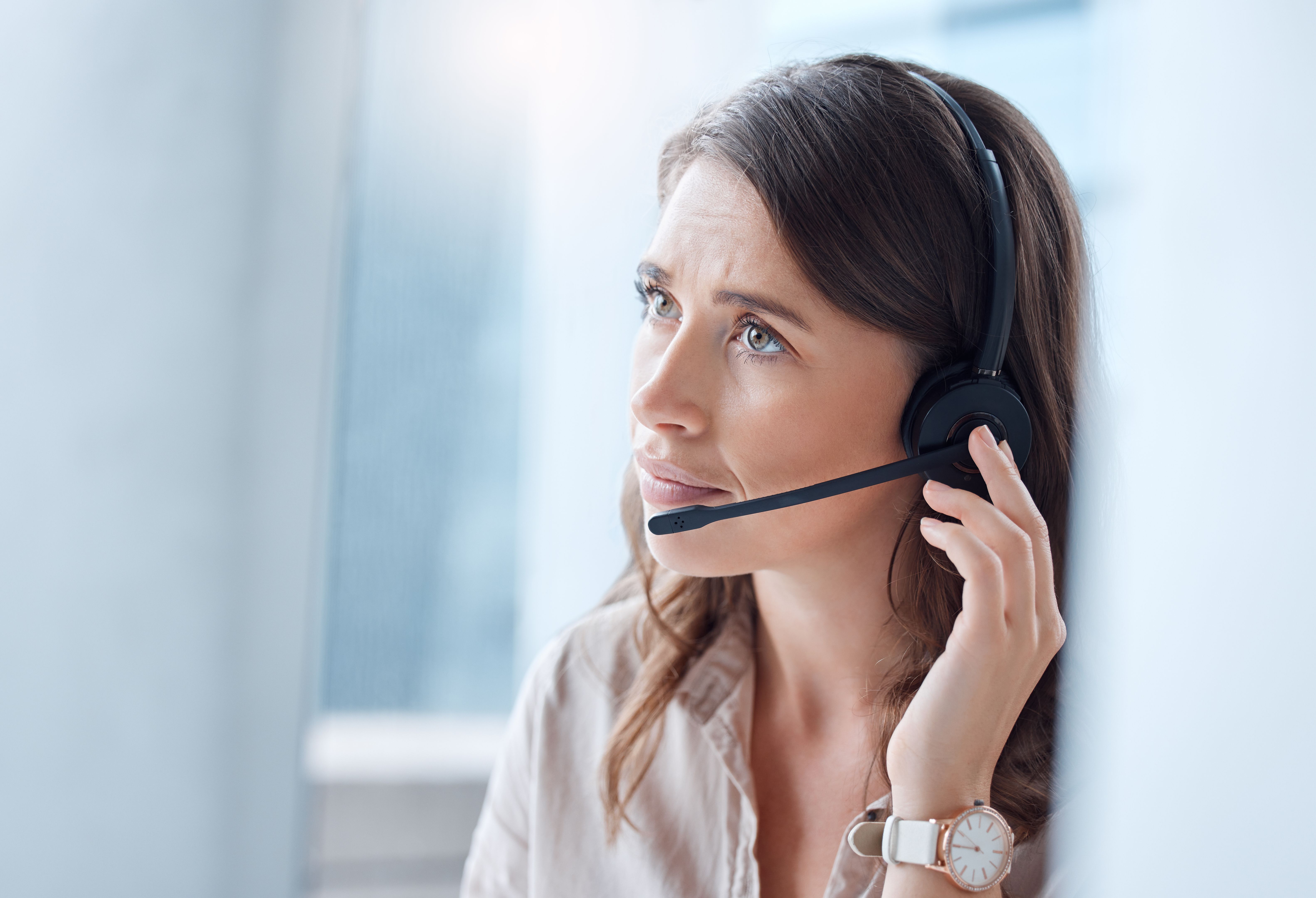 Shot of a young businesswoman working in a call center, Customer Service