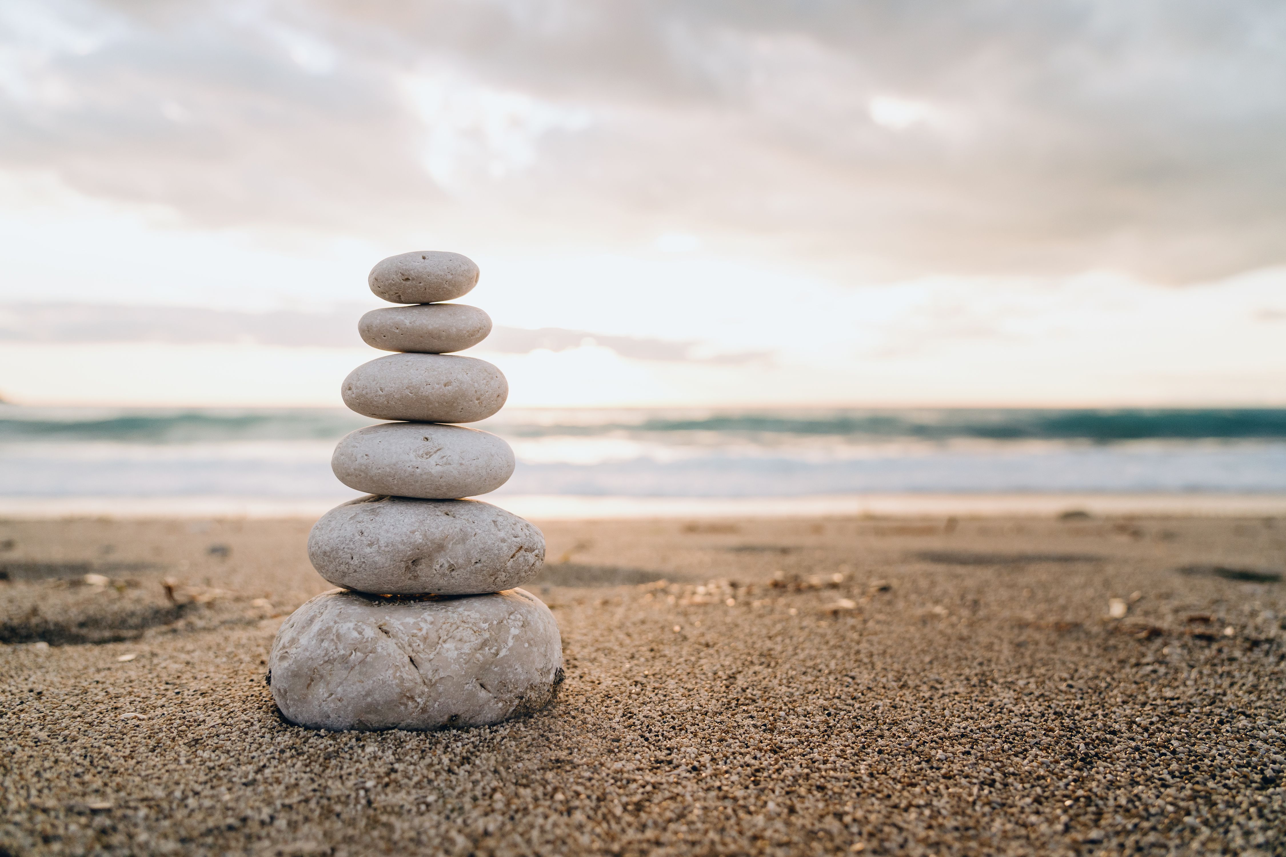 Zen Stones Balanced on a Peaceful Beach at Dawn