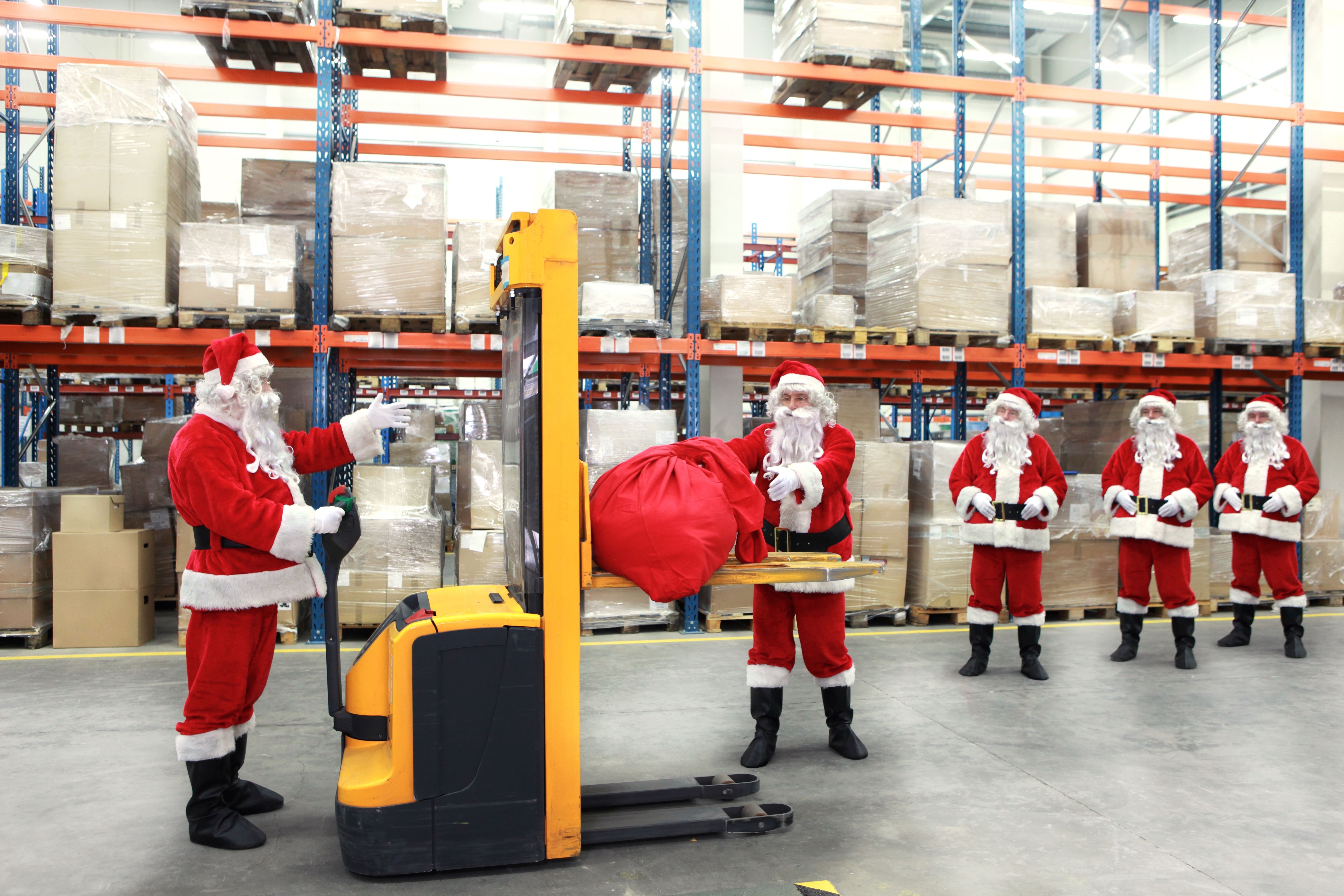 santa clauses in line for the sacks of gifts