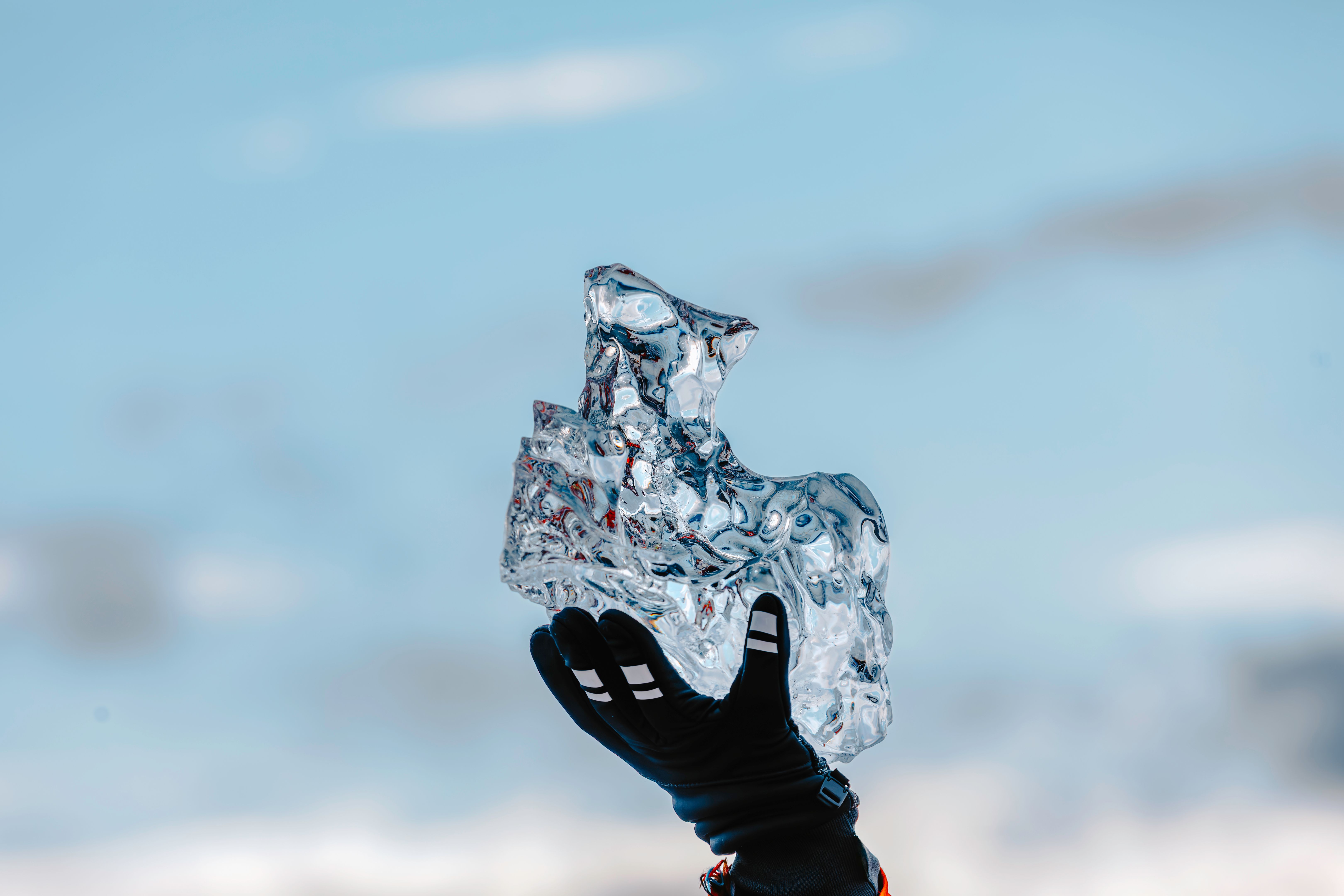 Hand Holding A Melting Ancient Glacier Ice in Iceland – Climate Change and Environmental Protection Concept Hand Holding A Melting Ancient Glacier Ice in Iceland – Climate Change and Environmental Protection Concept