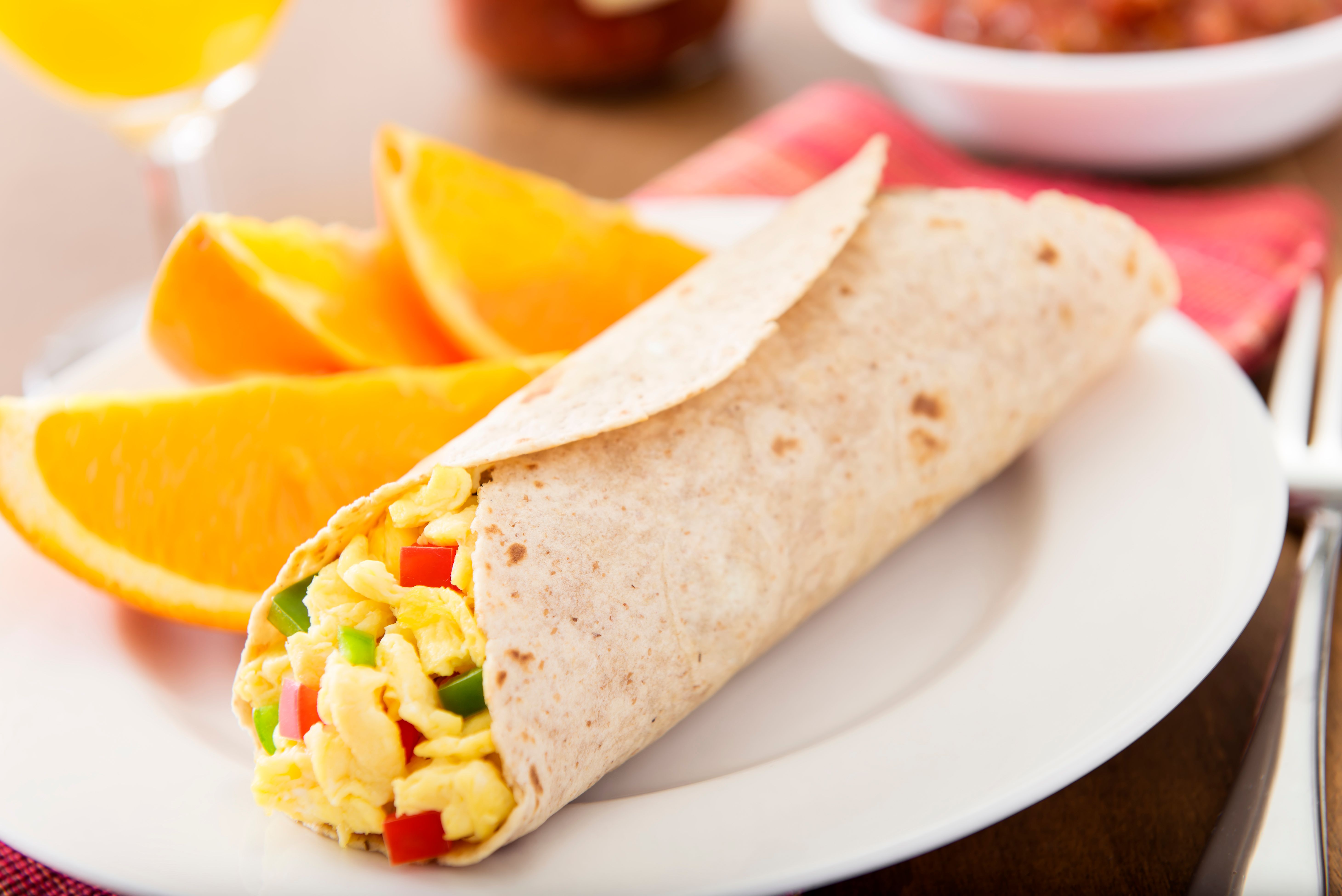 making breakfast burrito