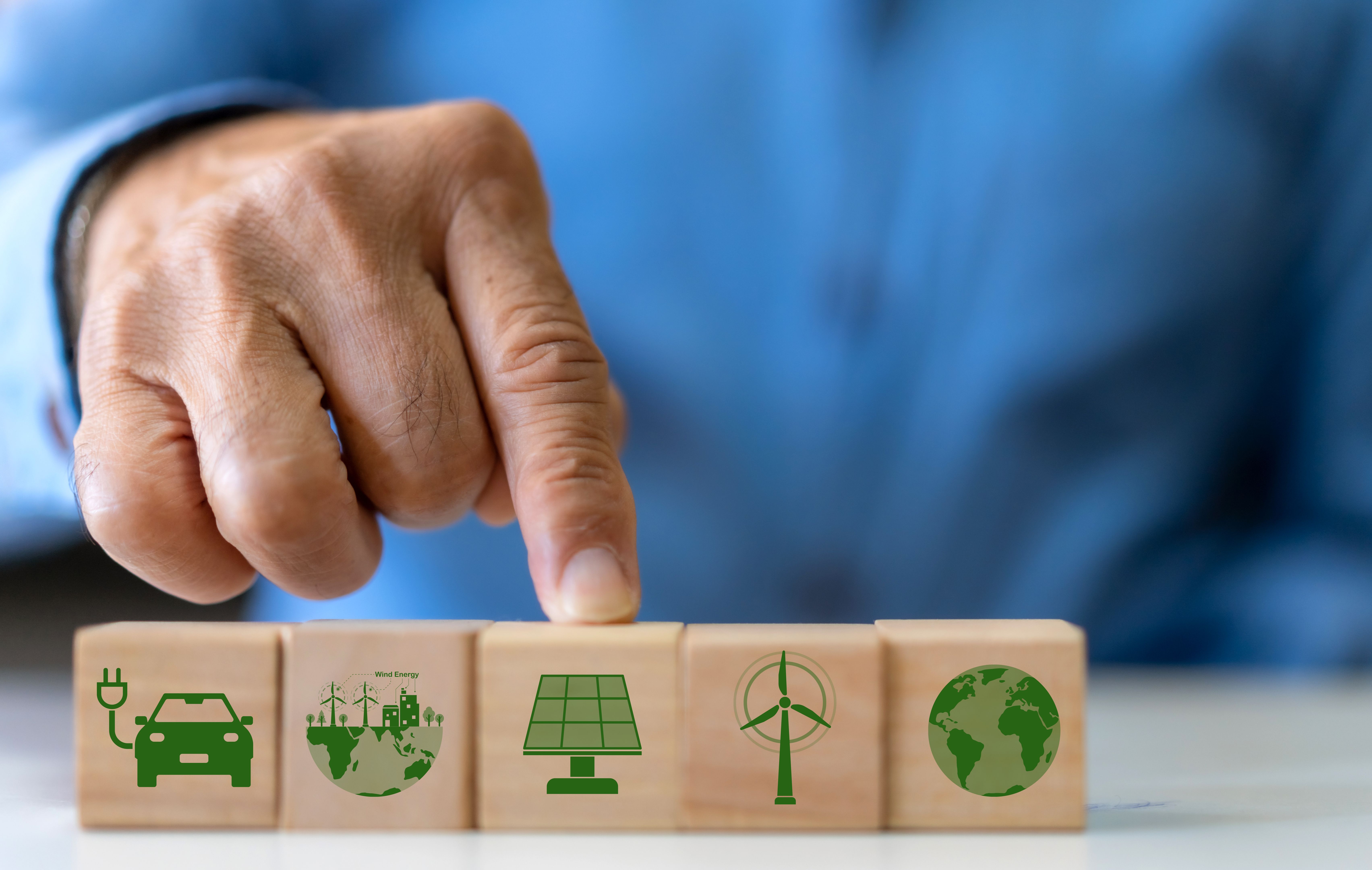 Hand holding wood block solar energy, saving clean energy earth, save the world, environment, green, eco friendly, net zero, ESG, ecology, CO2, carbon dioxide, ev car.campaign save earth, earth Day Hand holding wood block solar energy, saving clean energy earth, save the world, environment, green, eco friendly, net zero, ESG, ecology, CO2, carbon dioxide, ev car.campaign save earth, earth Day