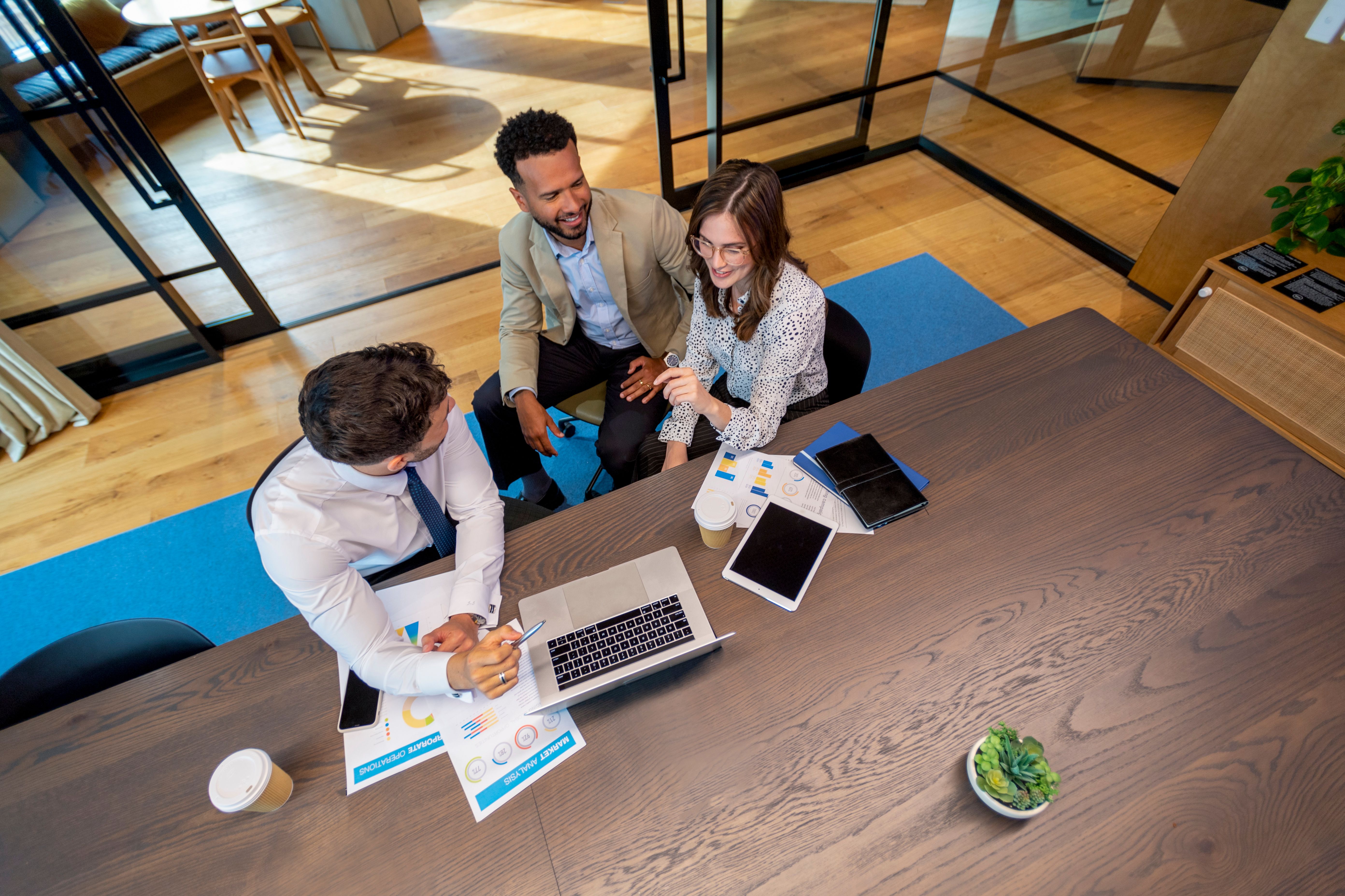 Financial advisor or lawyer with couple explaining options Financial advisor or lawyer with couple explaining options