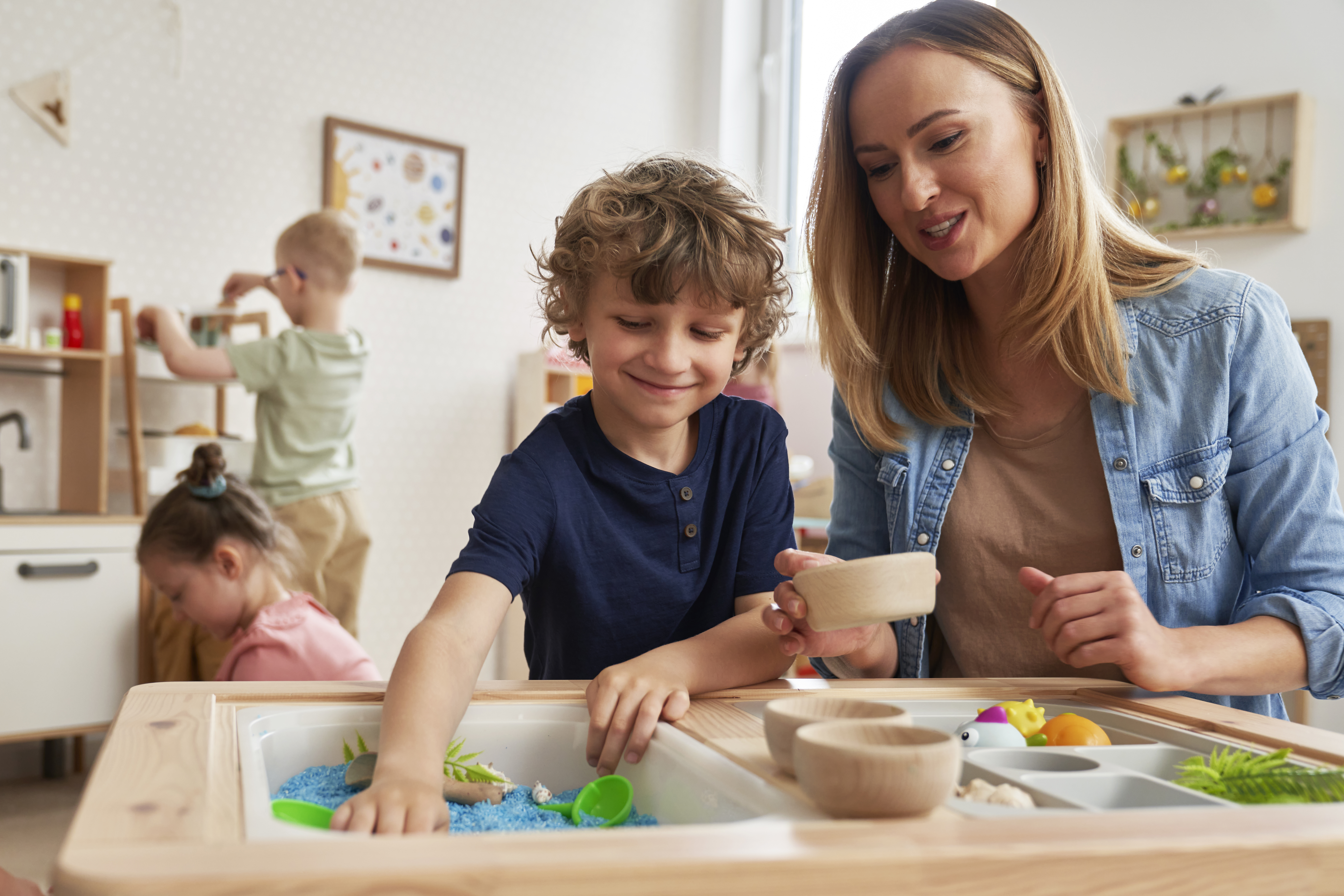 Physiotherapist doing sensory exercises with children Physiotherapist doing sensory exercises with children