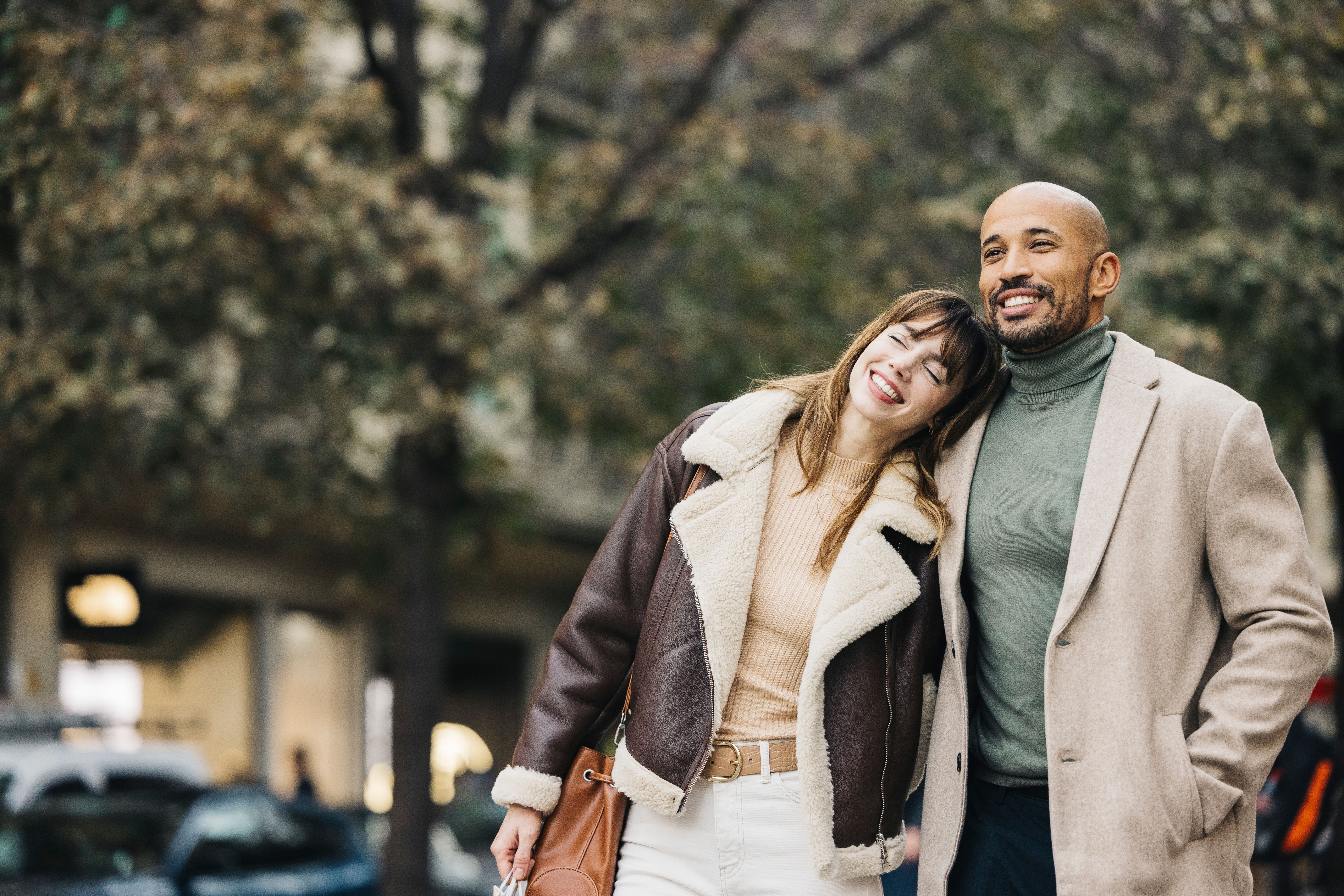 Couple enjoying a cheerful day shopping in the city.
