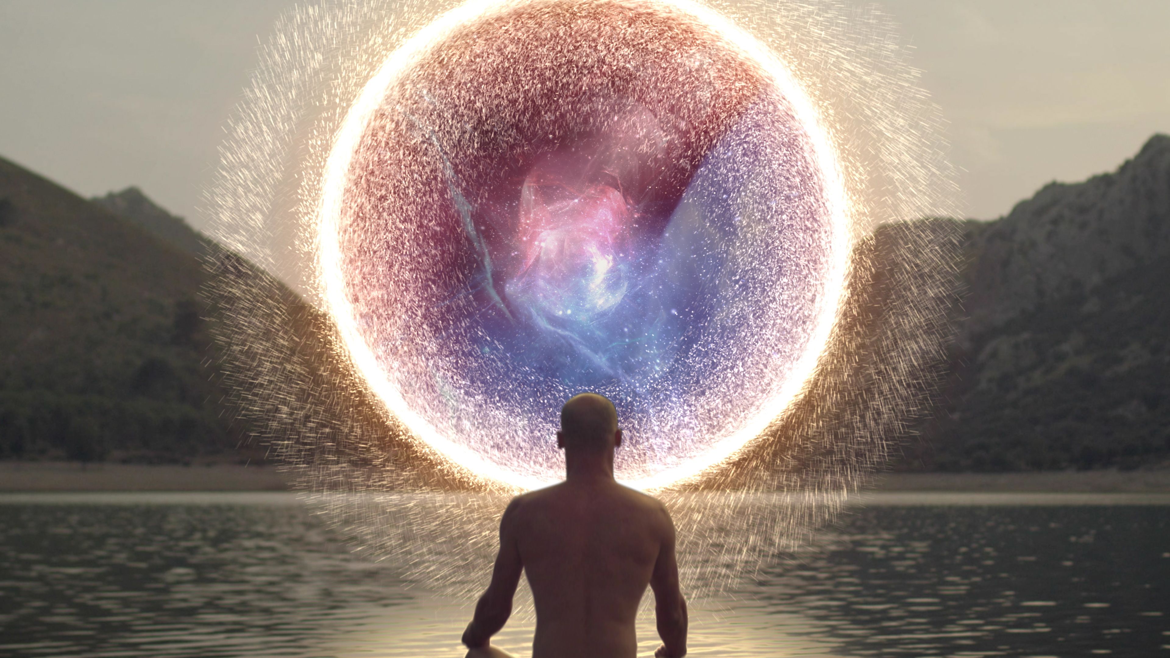 Meditating man opening portal to cosmic energy.