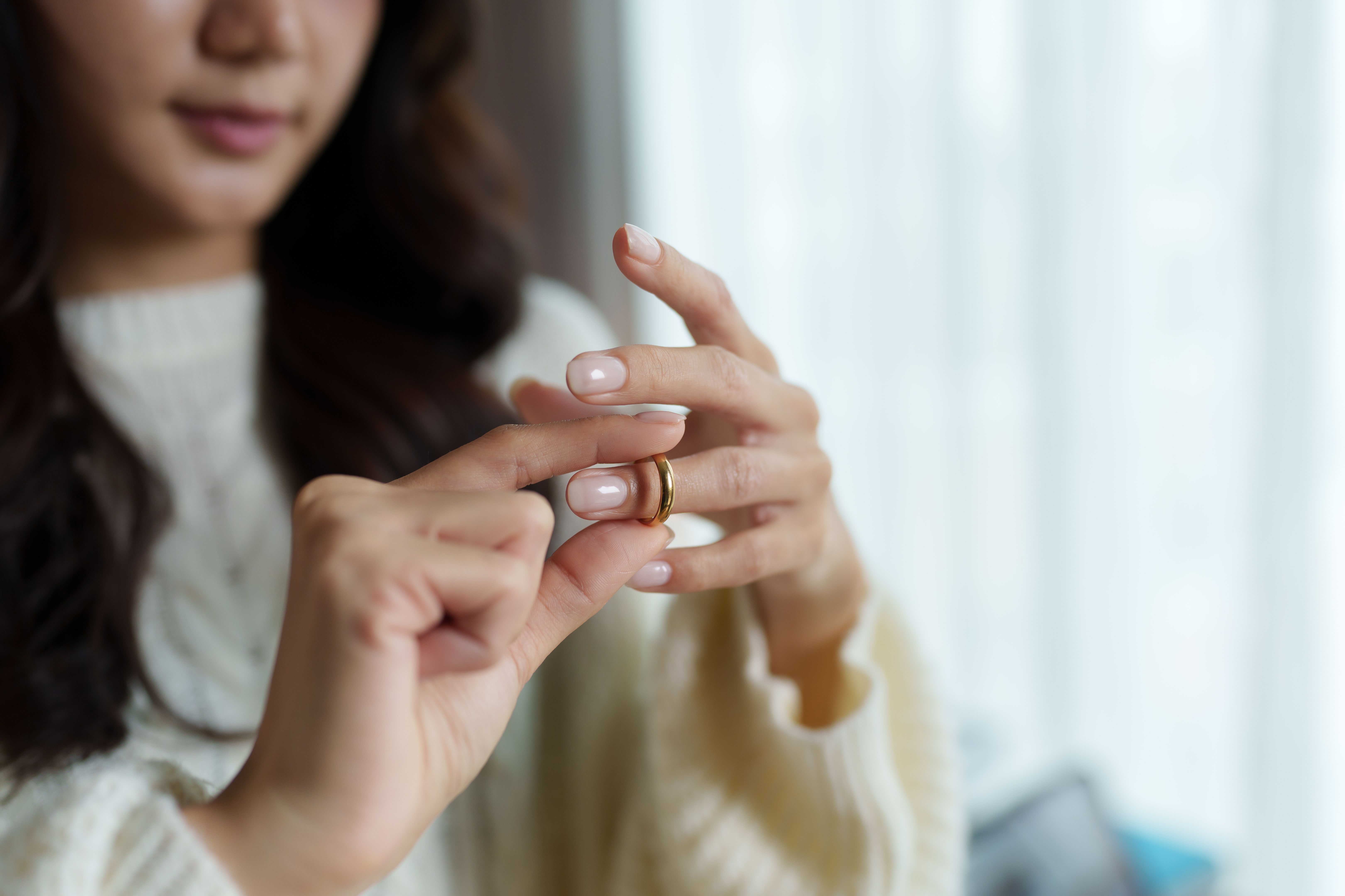 woman removing ring
