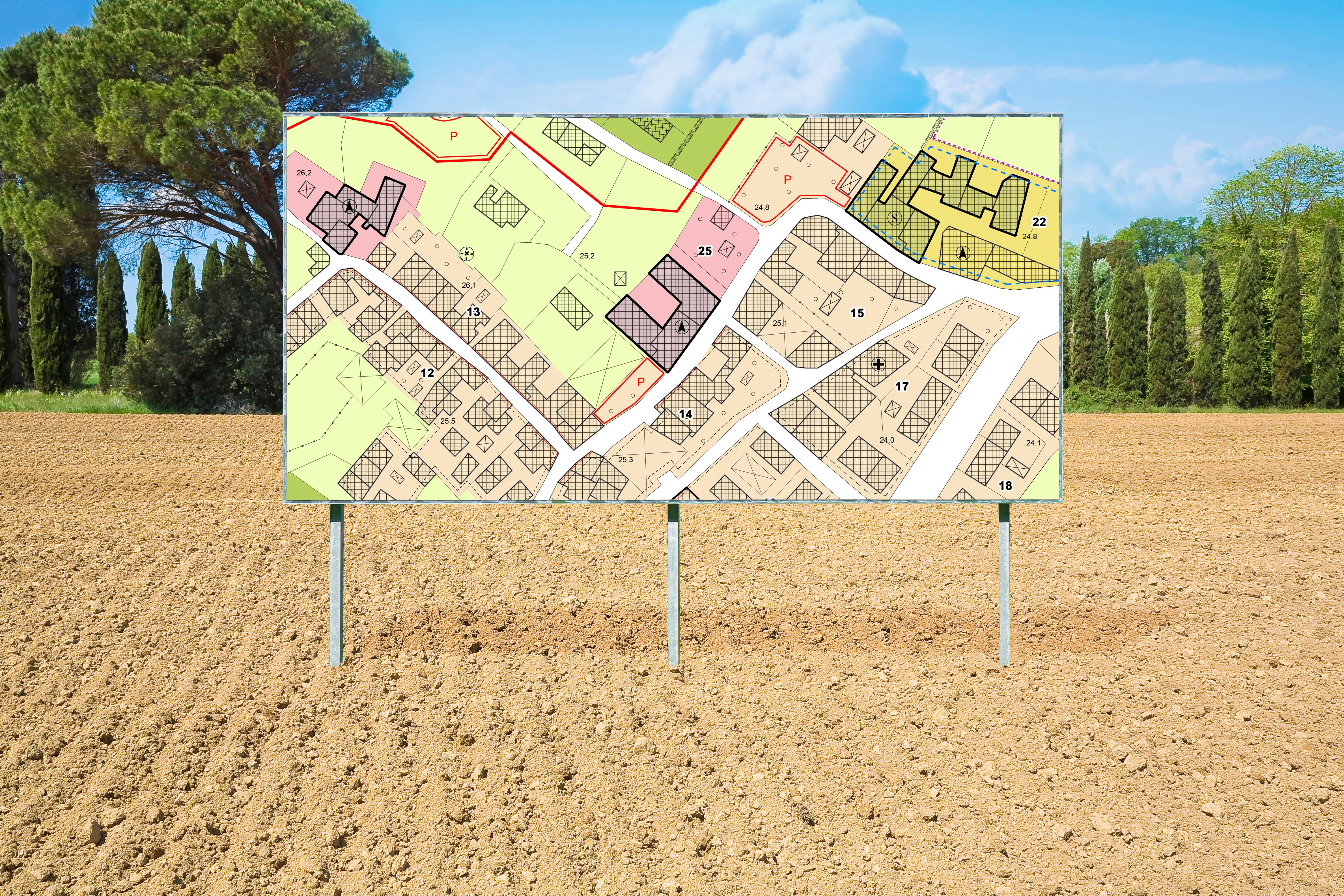 Advertising billboard with an imaginary General Urban Plan with indications of urban destinations buildable areas and land plot in a rural scene