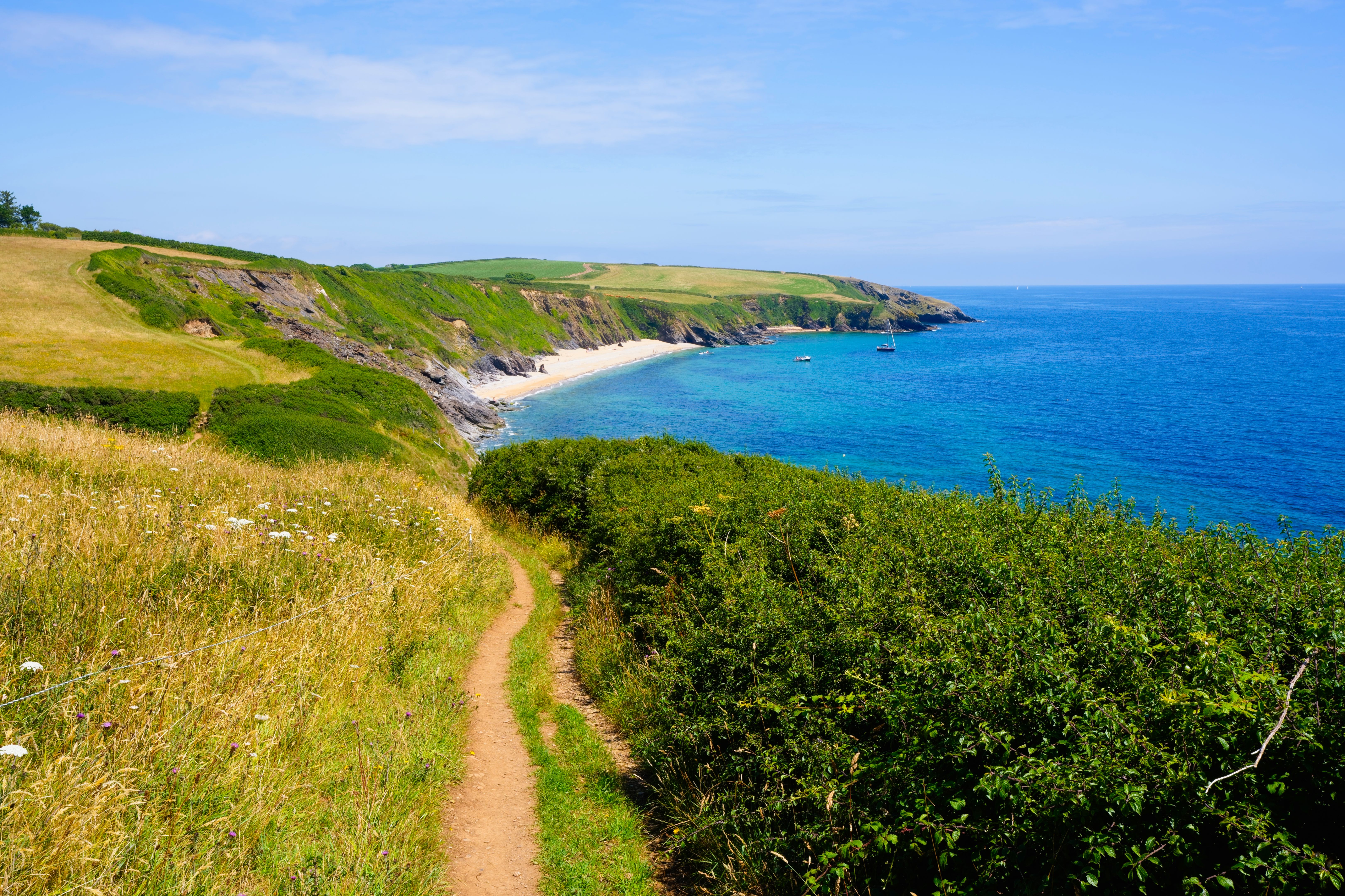 Following the South West Coastal Path on St. Anthony Head, Cornwall.