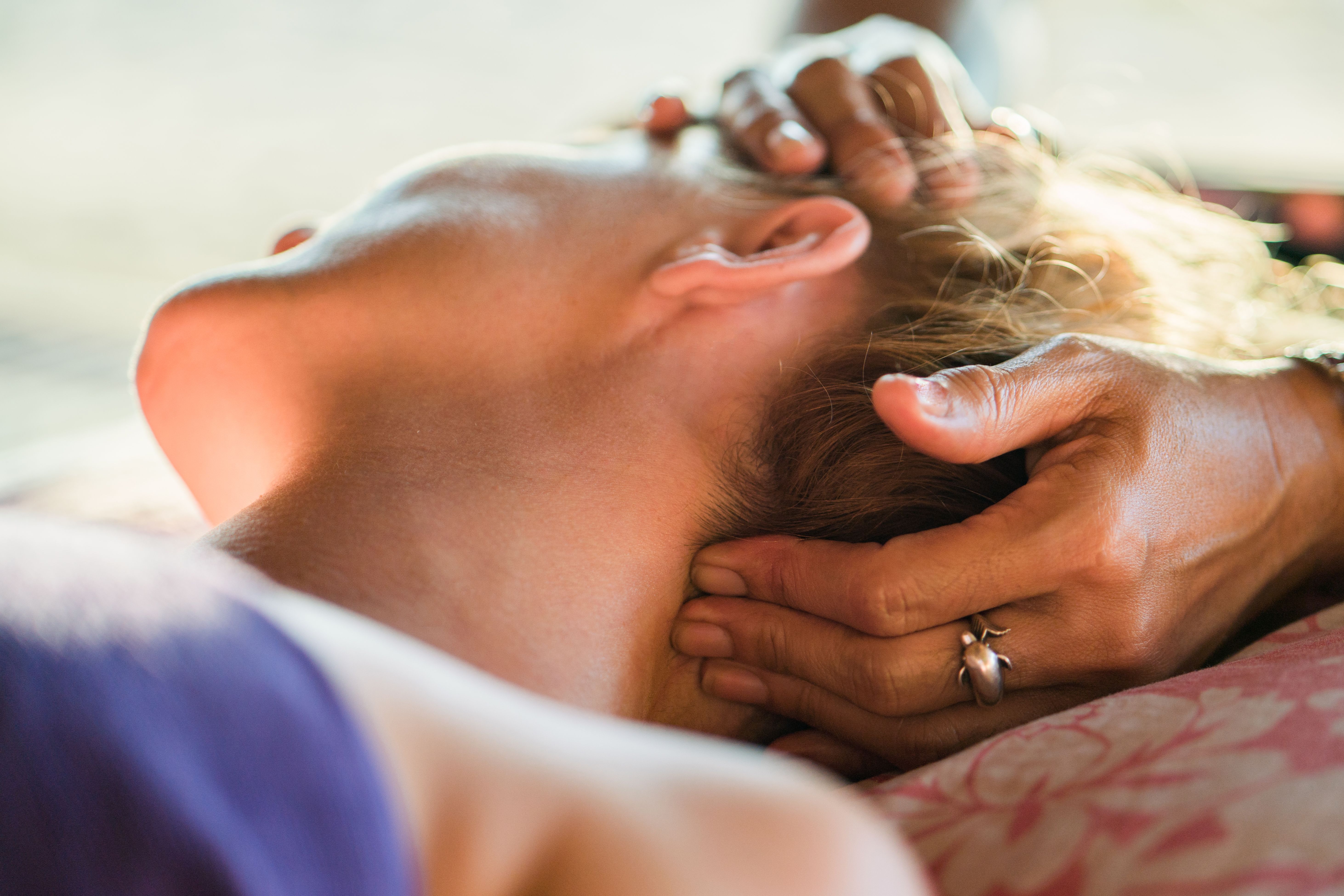 Close up of a woman having head massage at the spa.