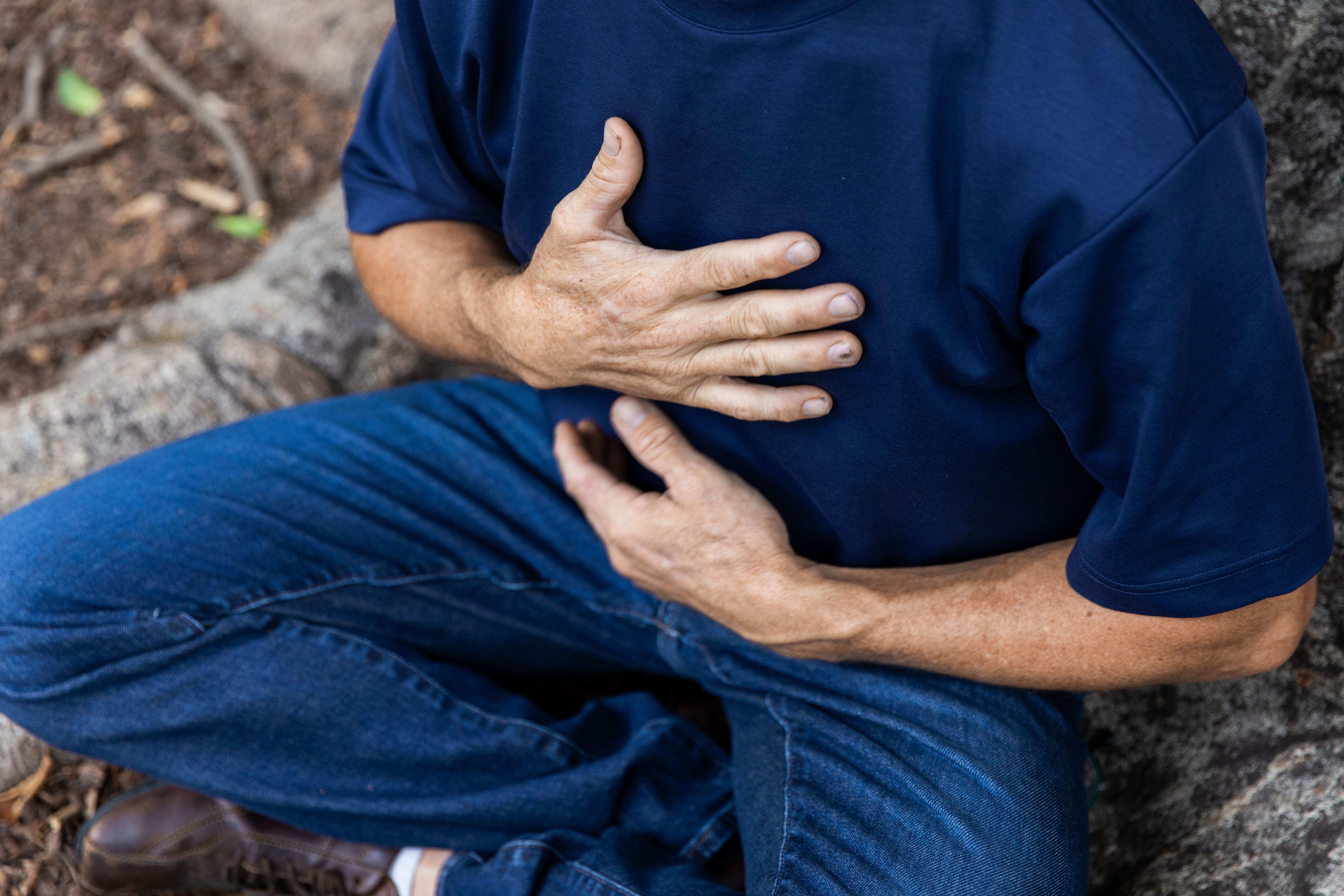 Mature aged man takes a mindful break in the park