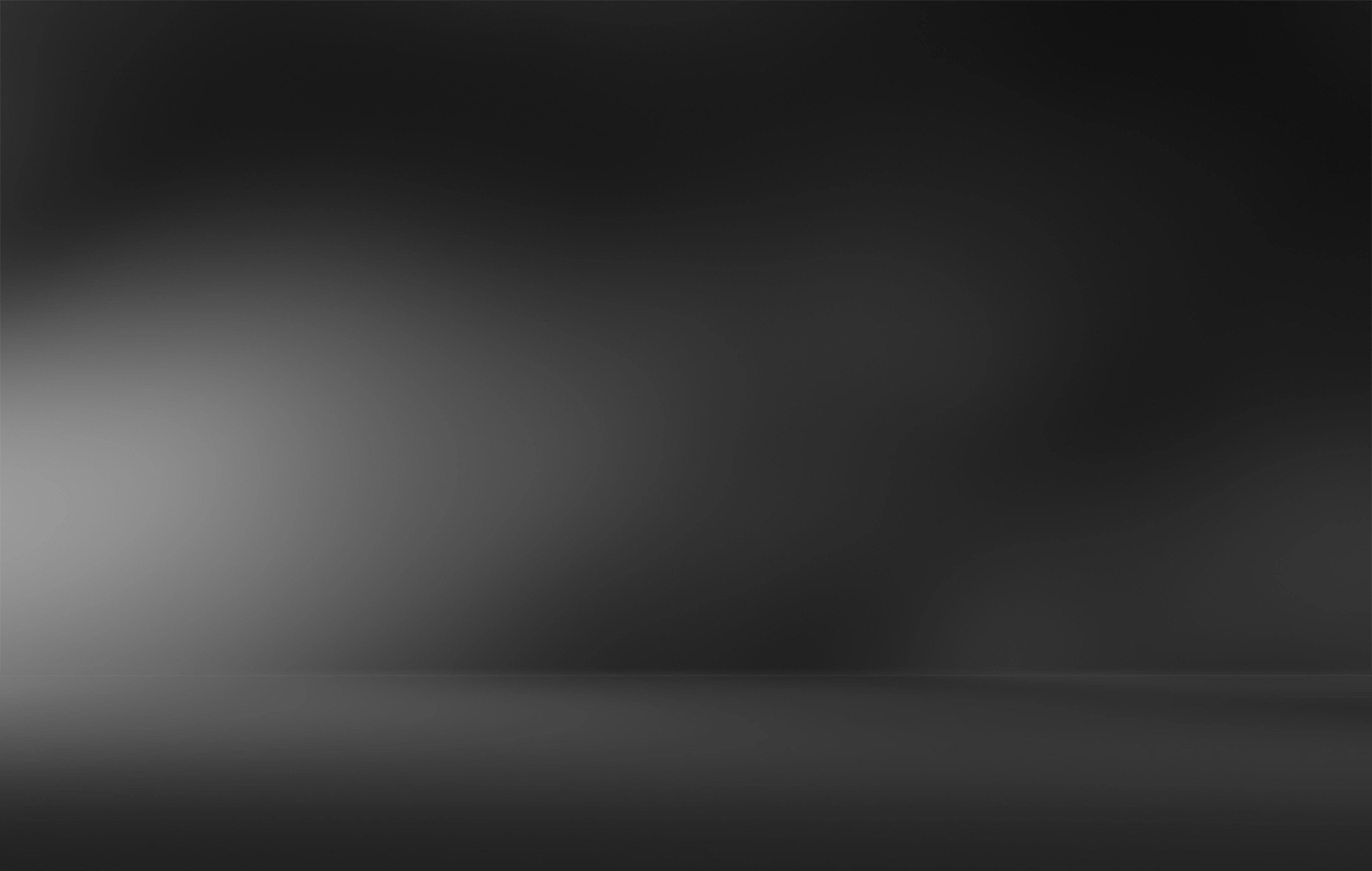 Empty black room studio with shadow overlay effect for product presentation display.