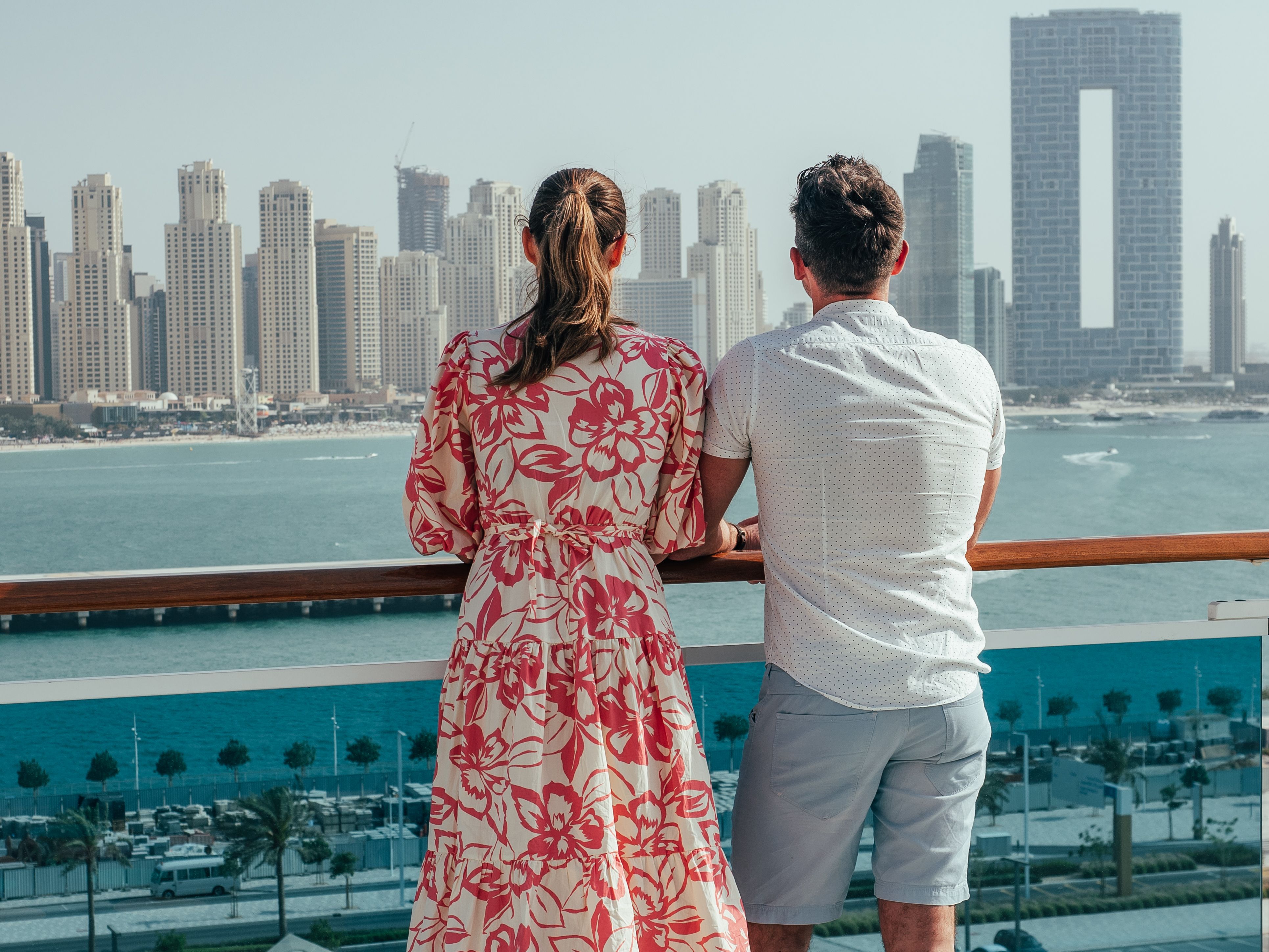 Stylish man and woman, standing on the empty deck