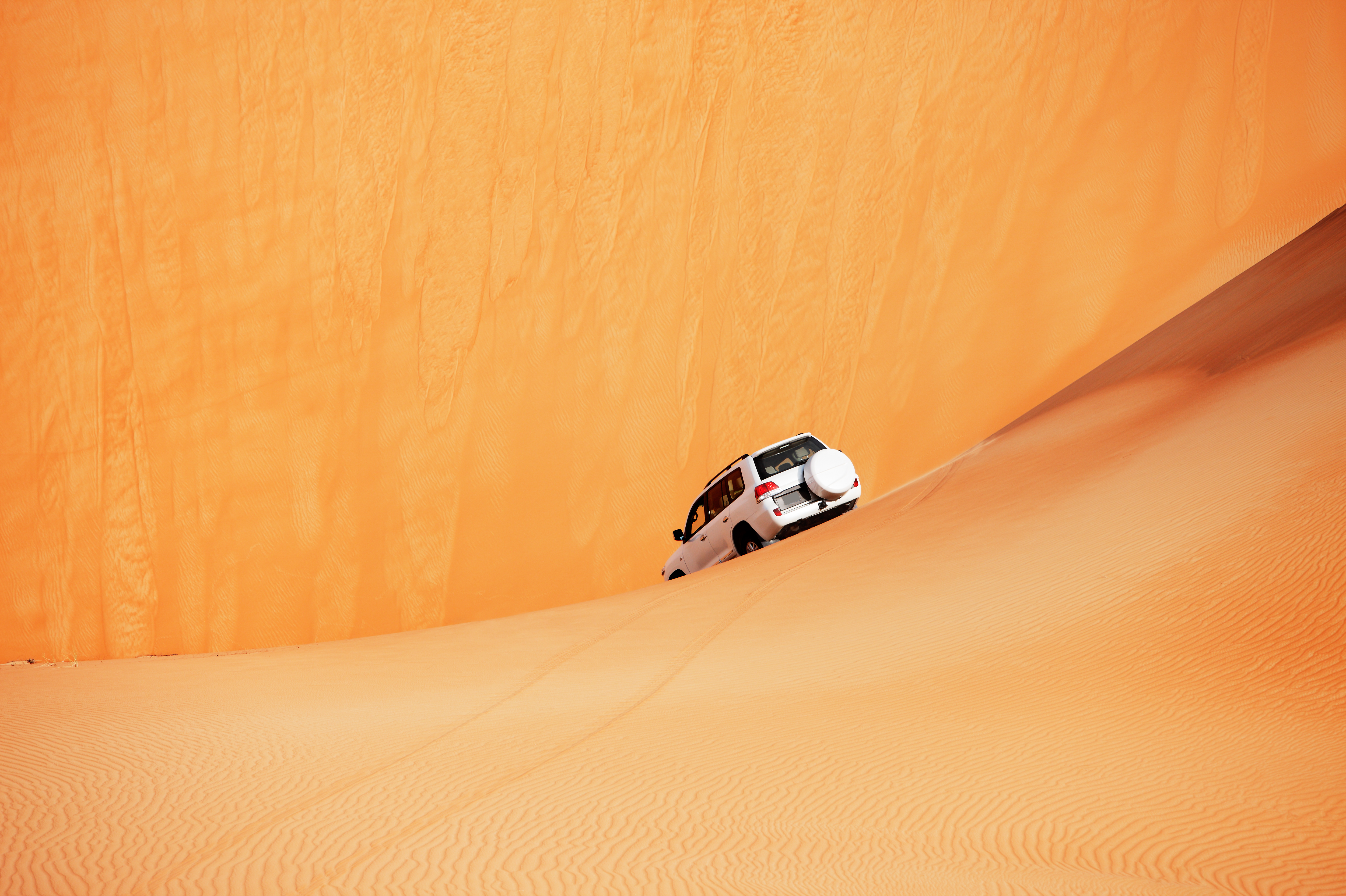 4x4 dune bashing through an Arabian desert