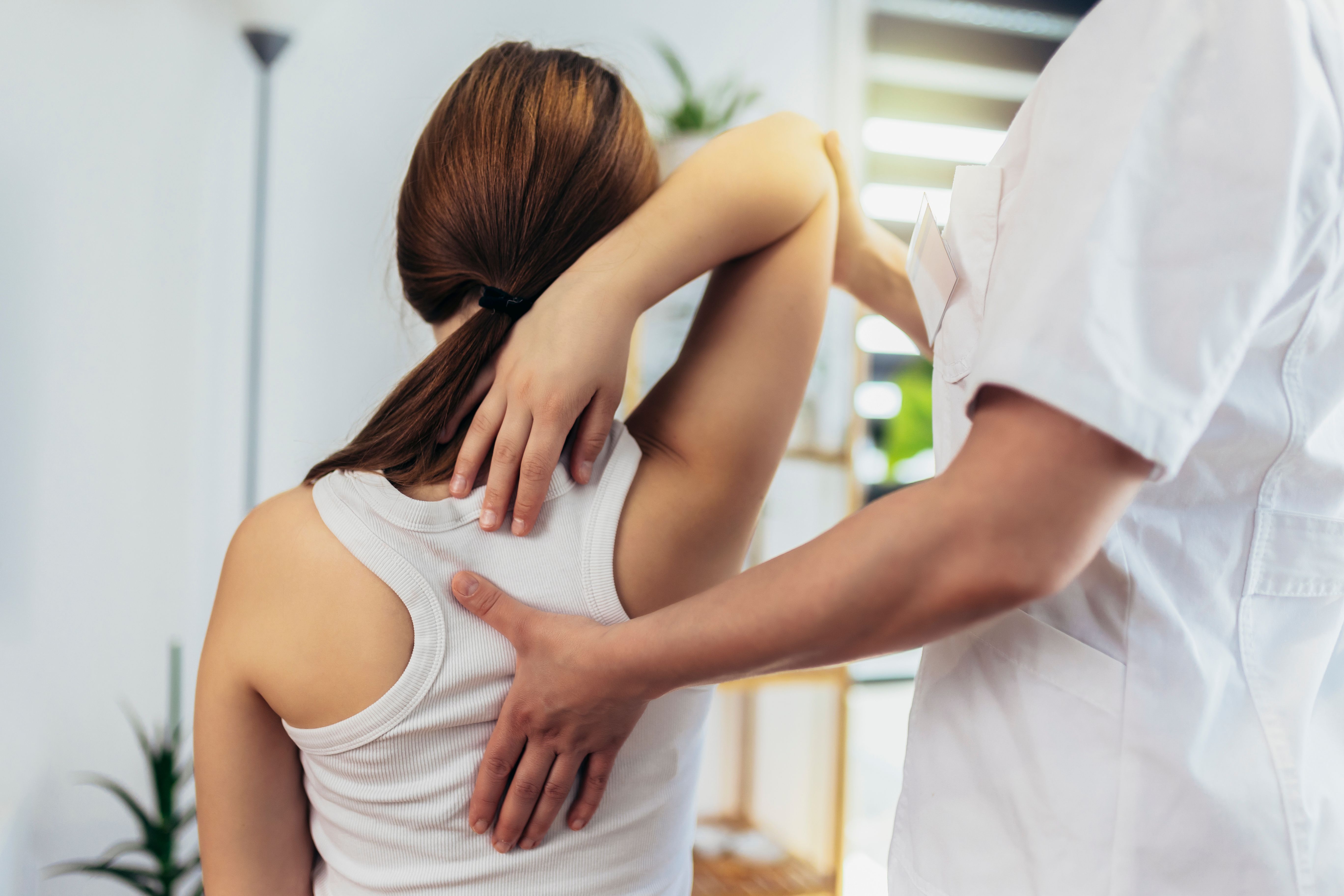 Teen Girl having chiropractic back adjustment.