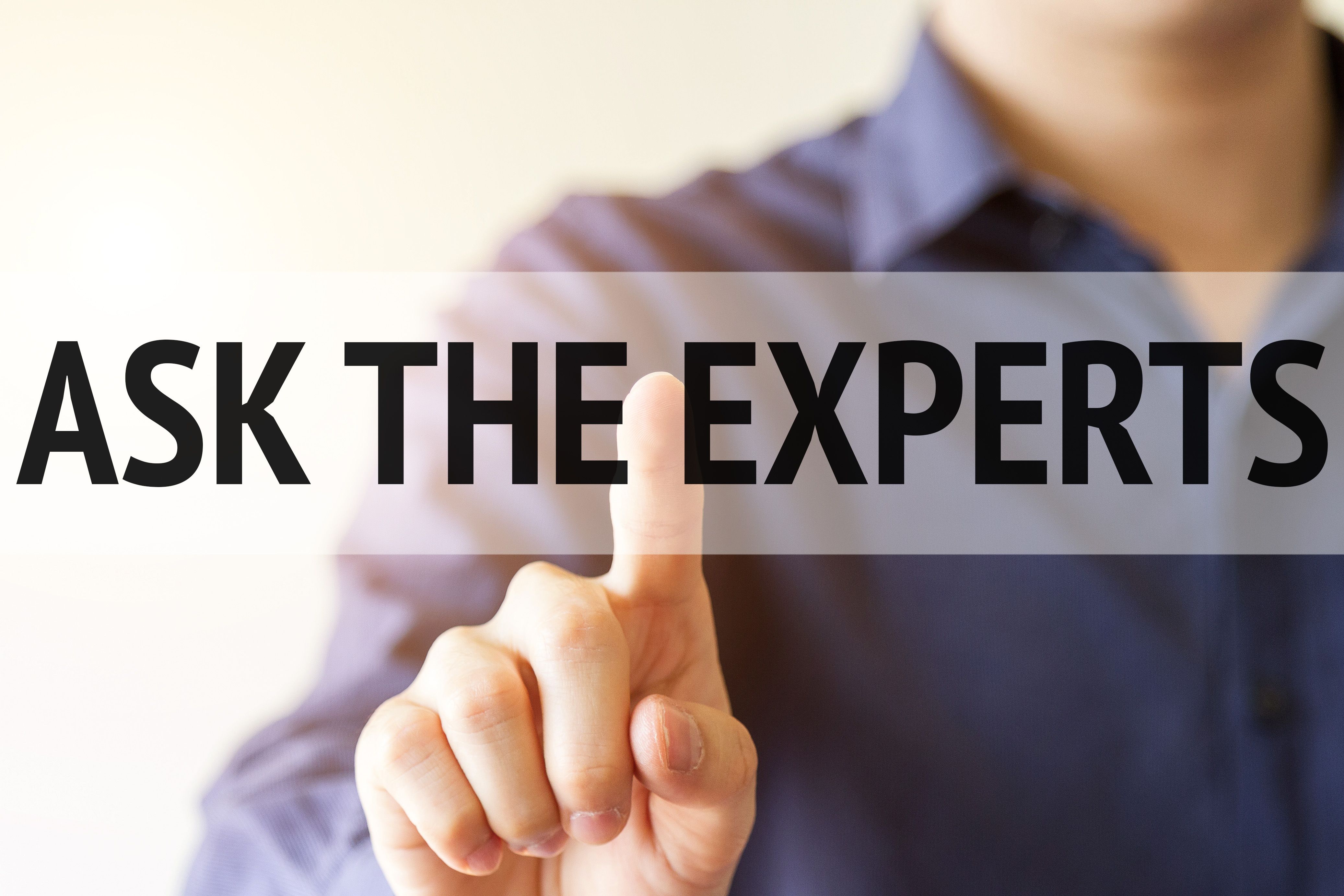 business man pointing on virtual screen with text word: ask the experts