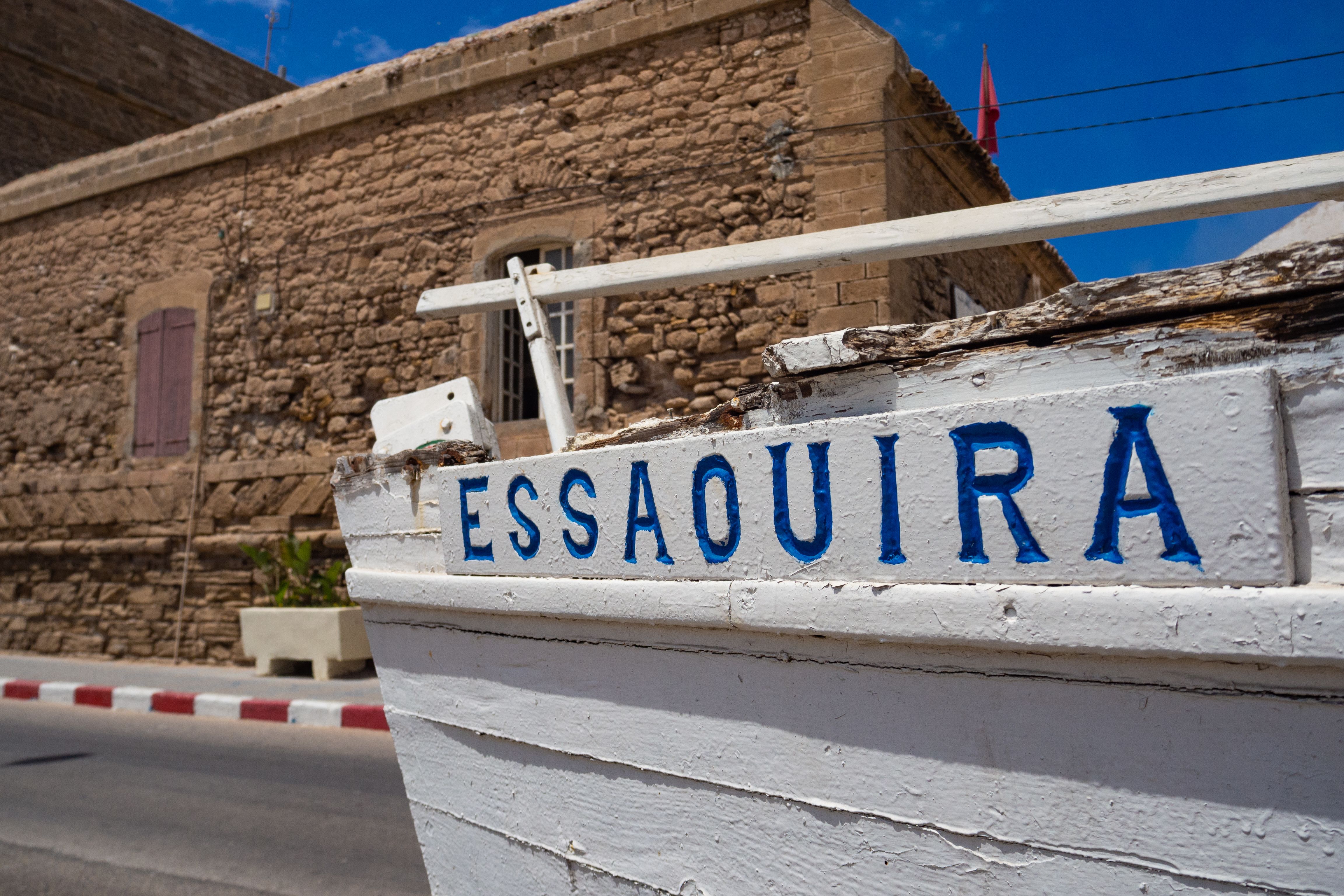 Sign painted on a boat indicating the enchanting city of Essaouira, Morocco.
