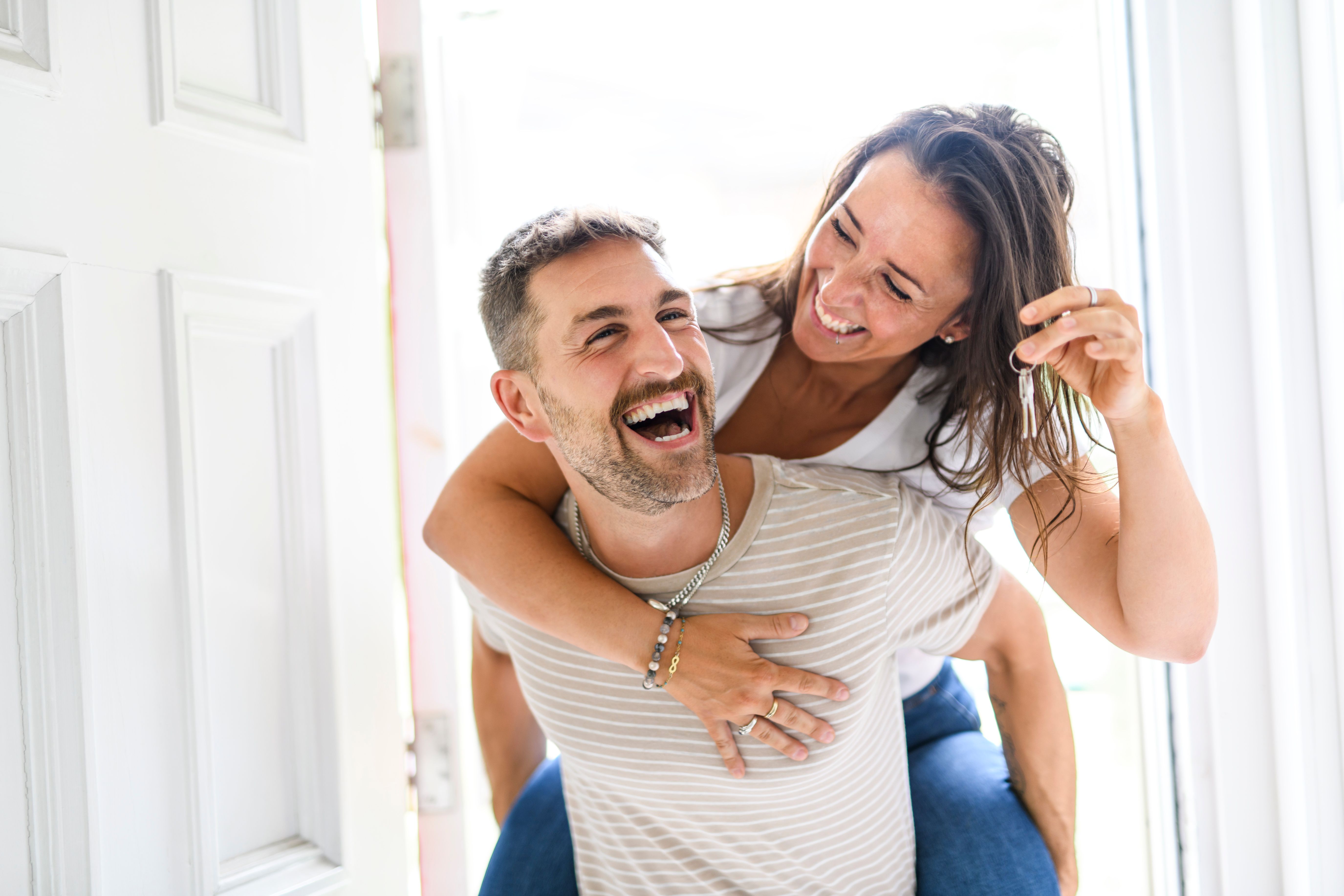 couple move into the home at new home. Relocation, moving to new home concept