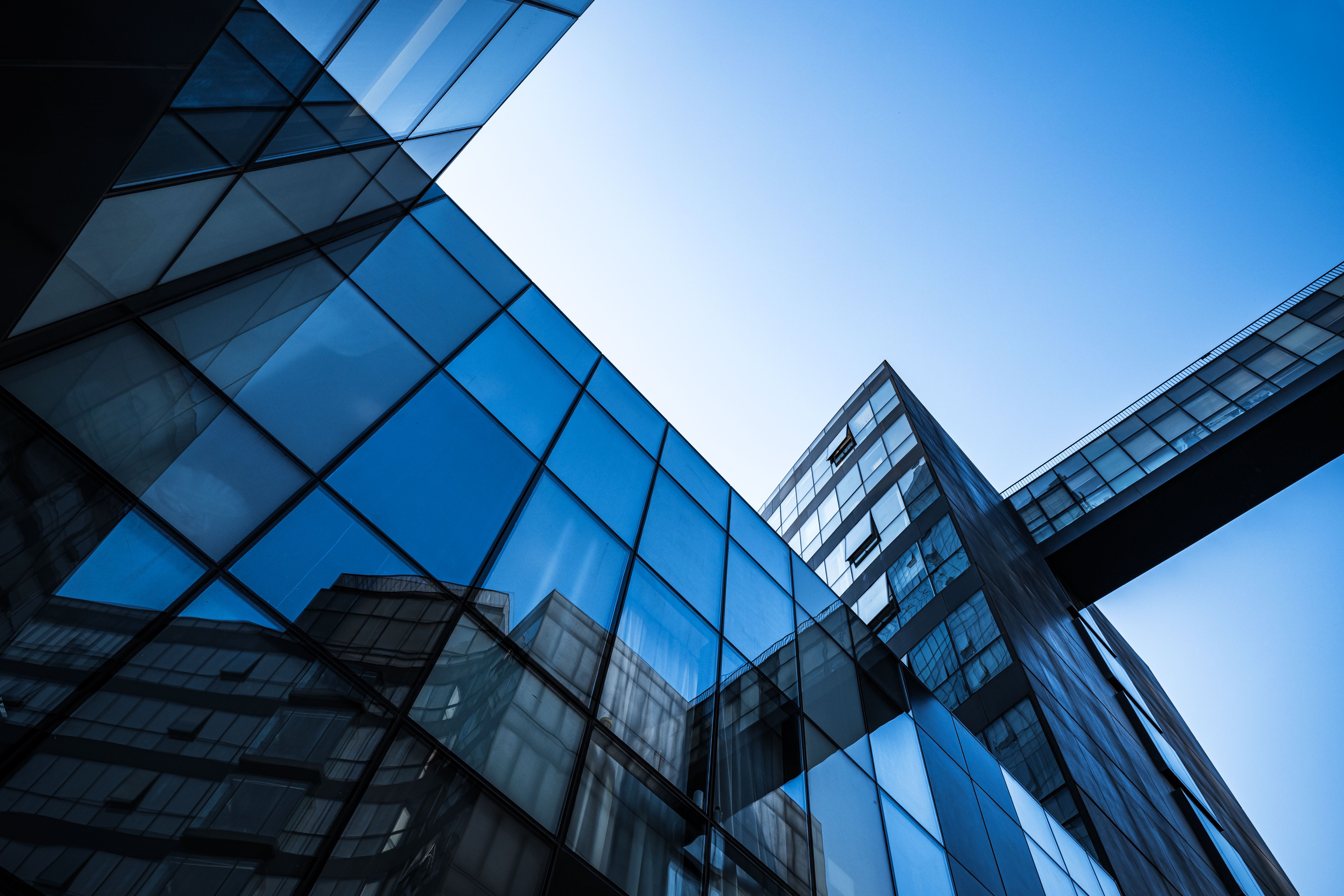 Modern Cityscape with Reflective Glass Buildings and Sunlight