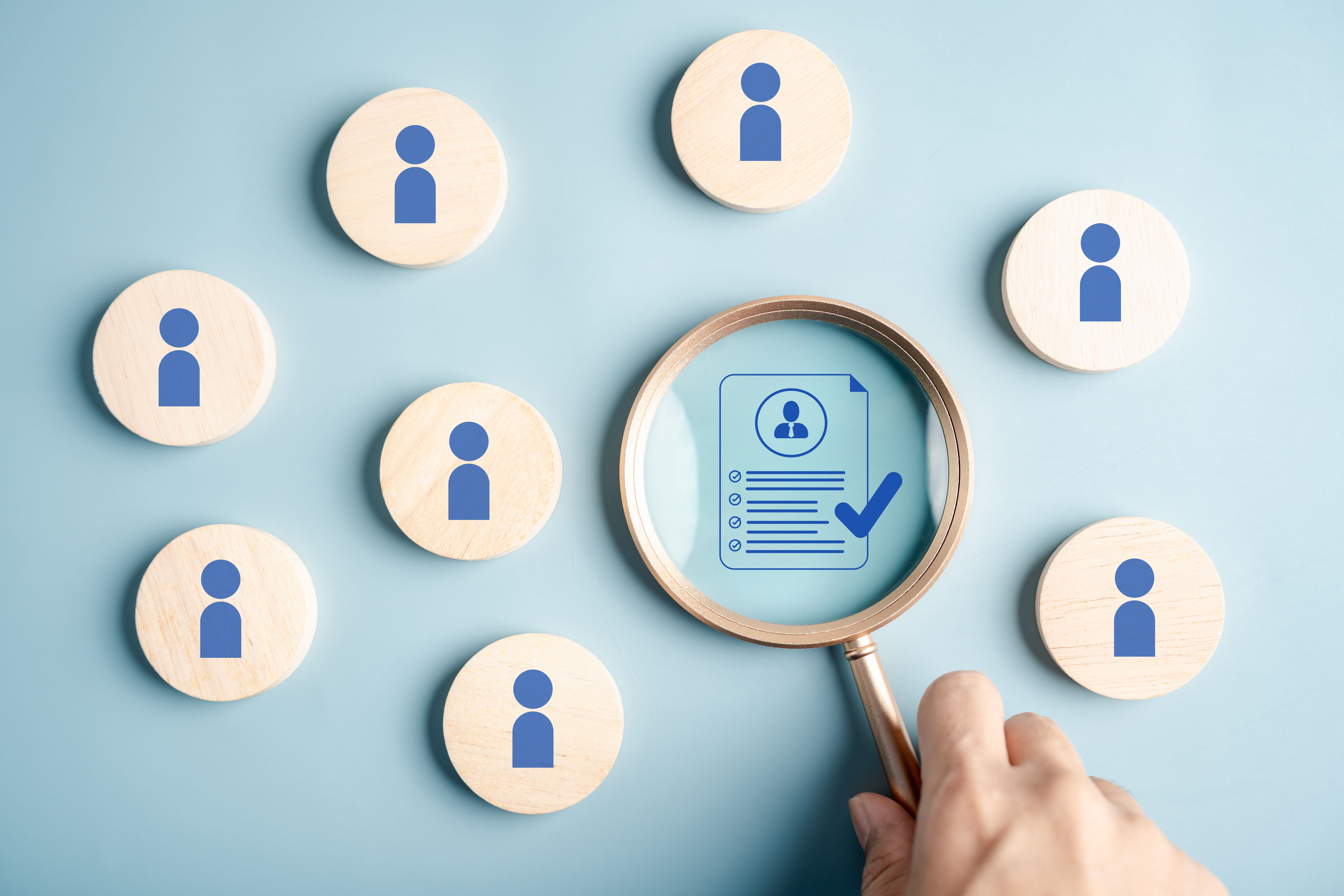 Human resource with candidate profile magnifying glass, representing recruitment, resume review, job interview, and HR hiring process.
