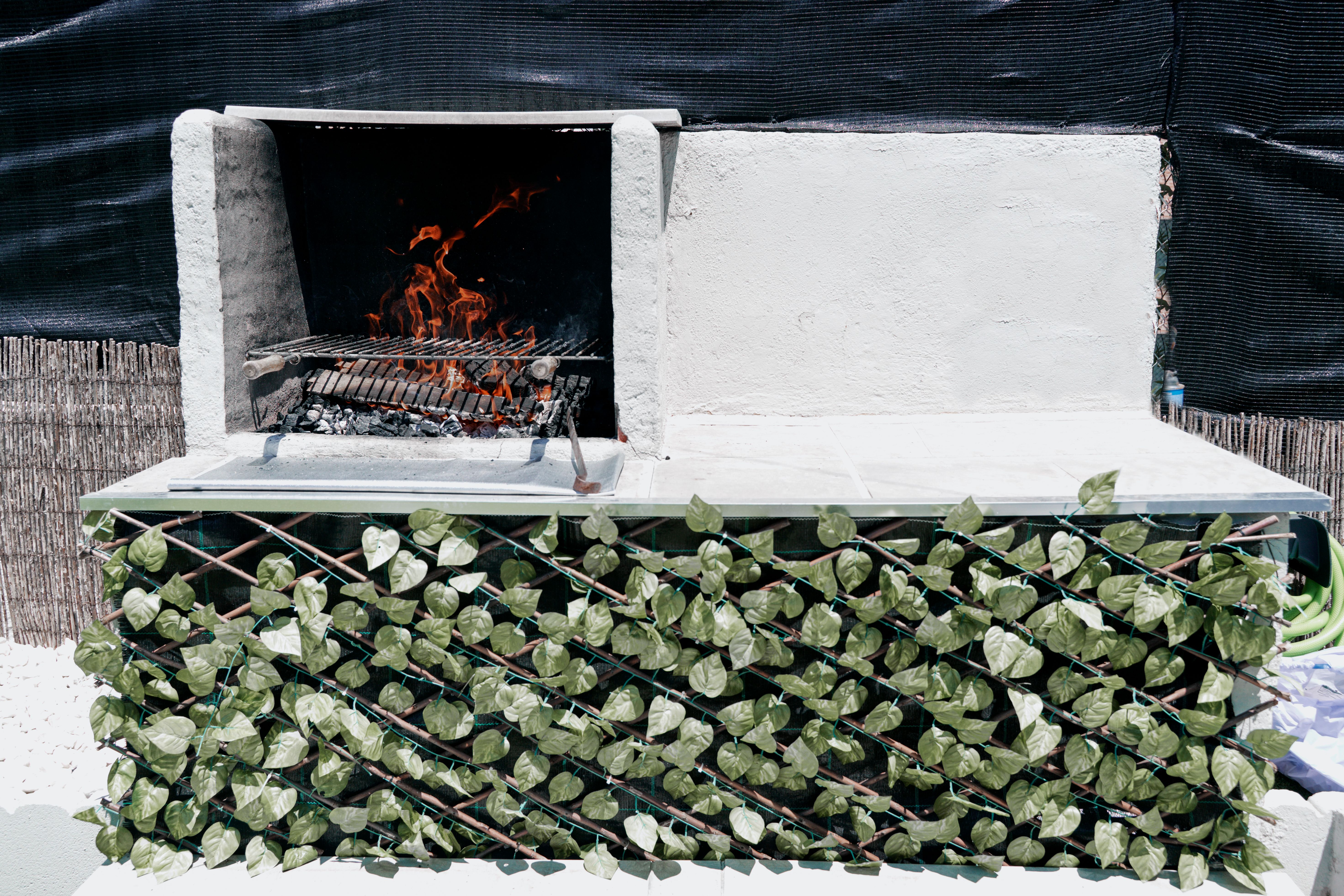 Front view of a barbecue grill on an outdoor patio Front view of a barbecue grill on an outdoor patio