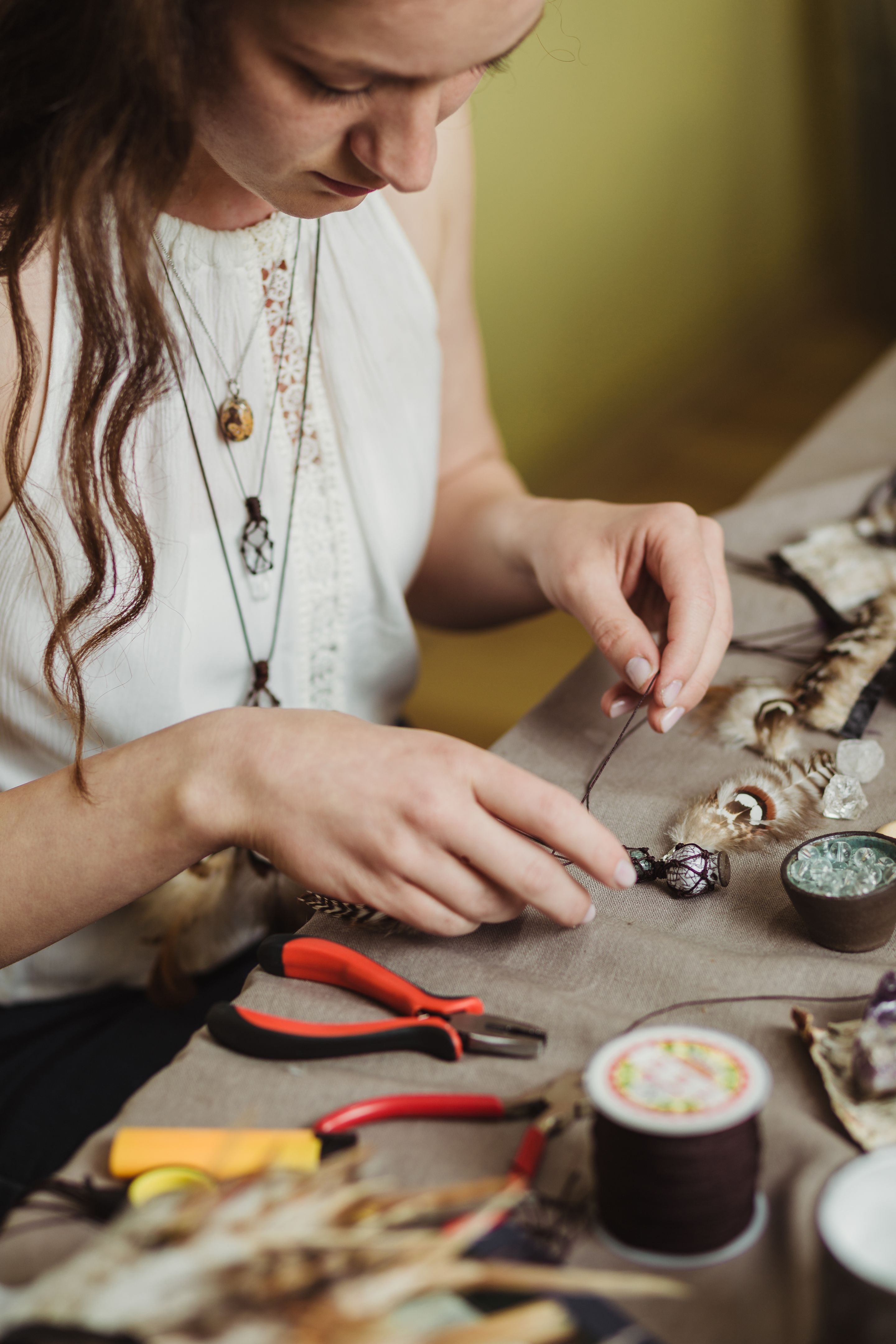 Artisan woman making gemstone jewelry