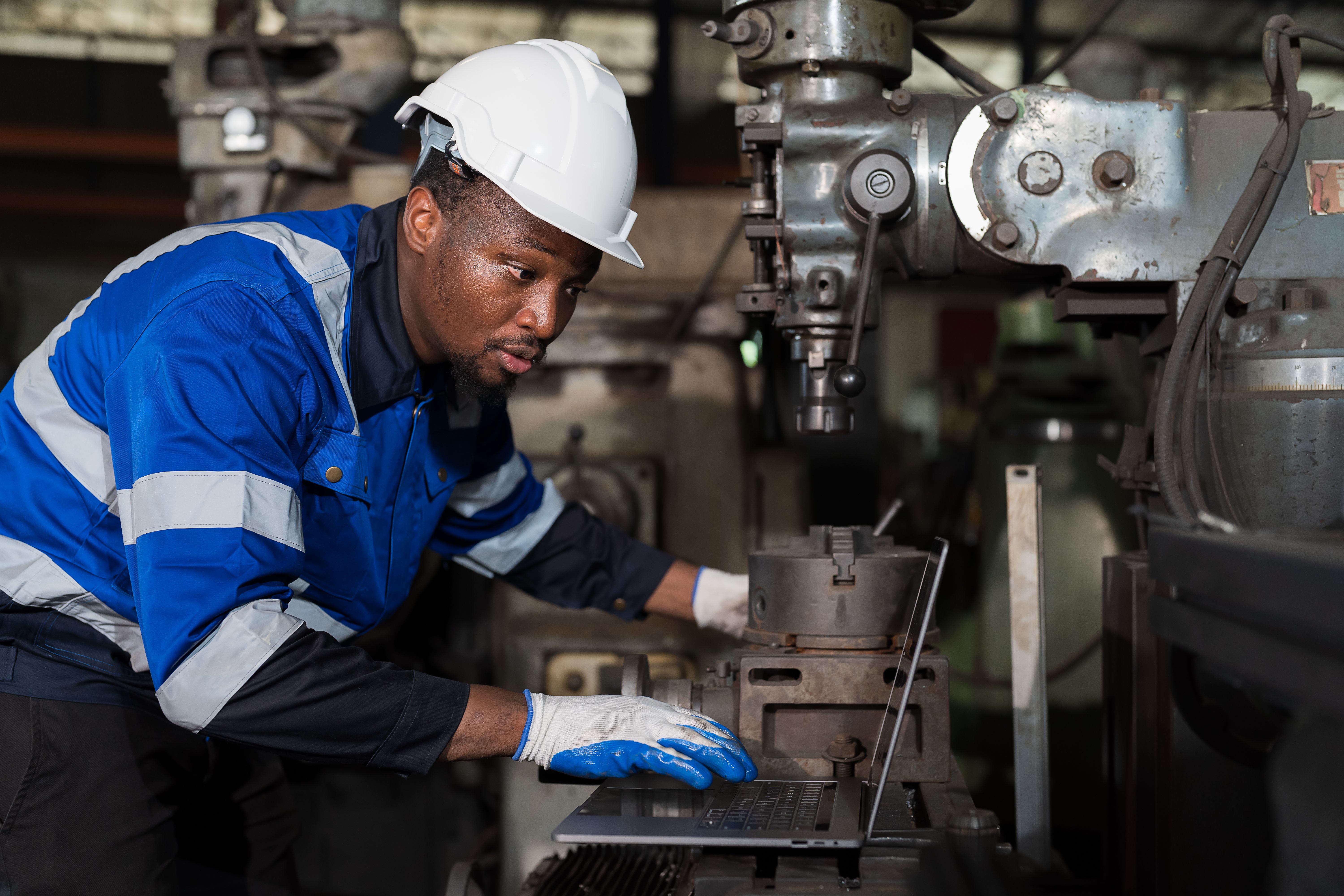 technician inspecting drill